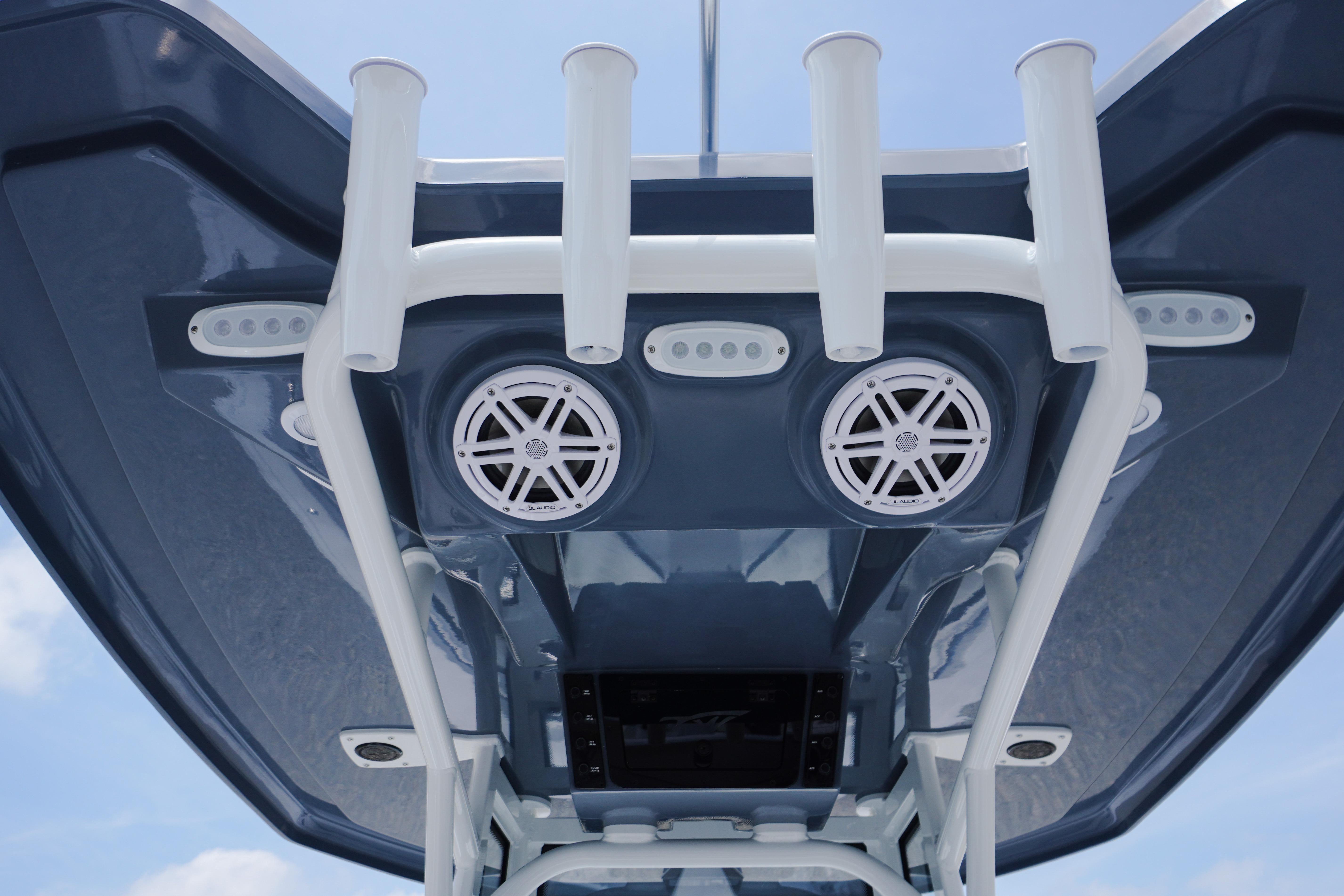 Tidewater 220 CC Adventure 2027 boat roof with speakers and rod holders.