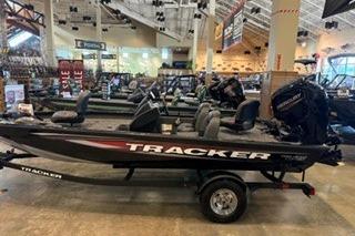 2026 Tracker Pro Team 175 boat displayed indoors on a trailer.