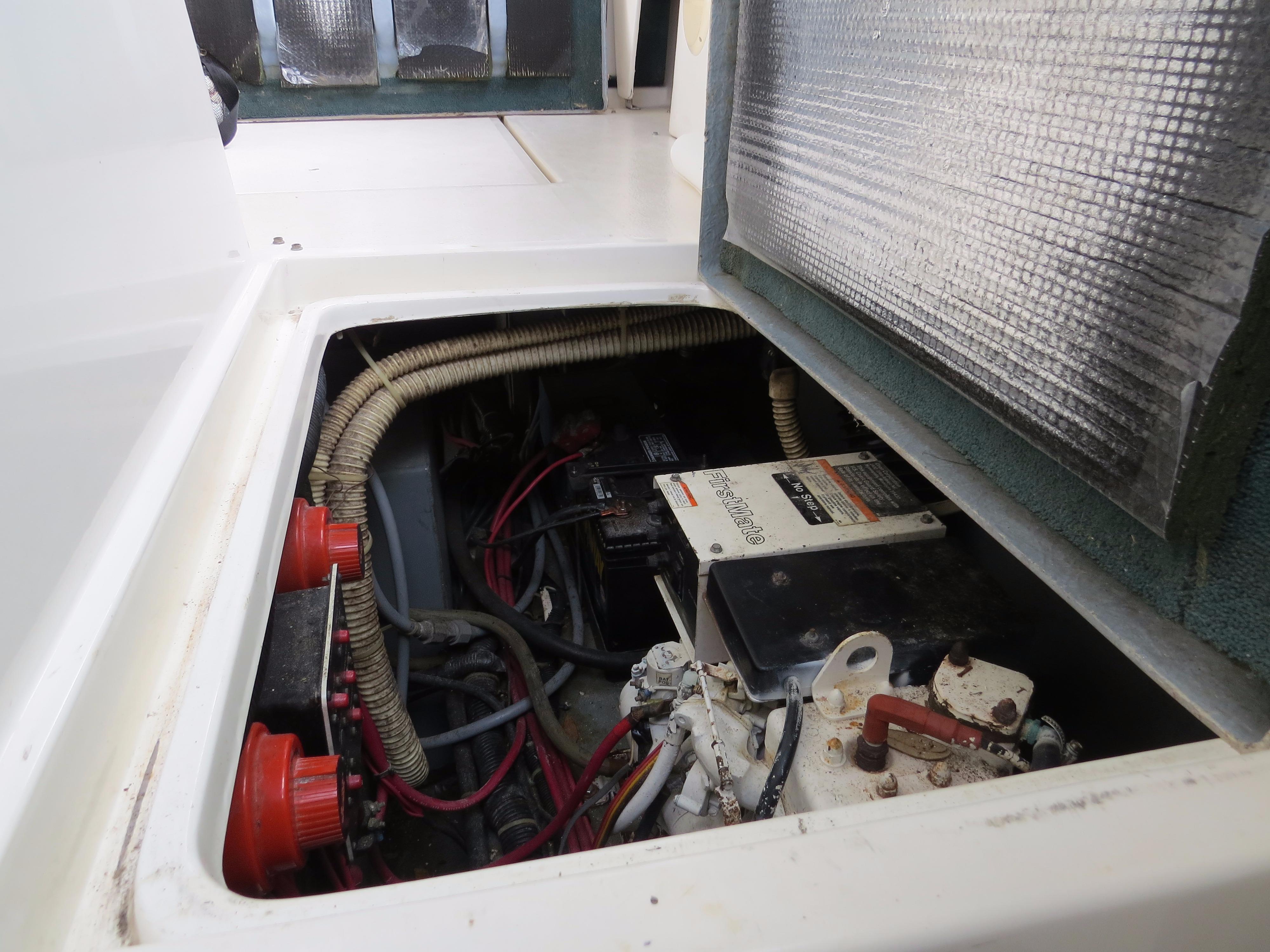 Engine compartment of 1989 Sea Ray Sundancer 280 with visible wiring and components.