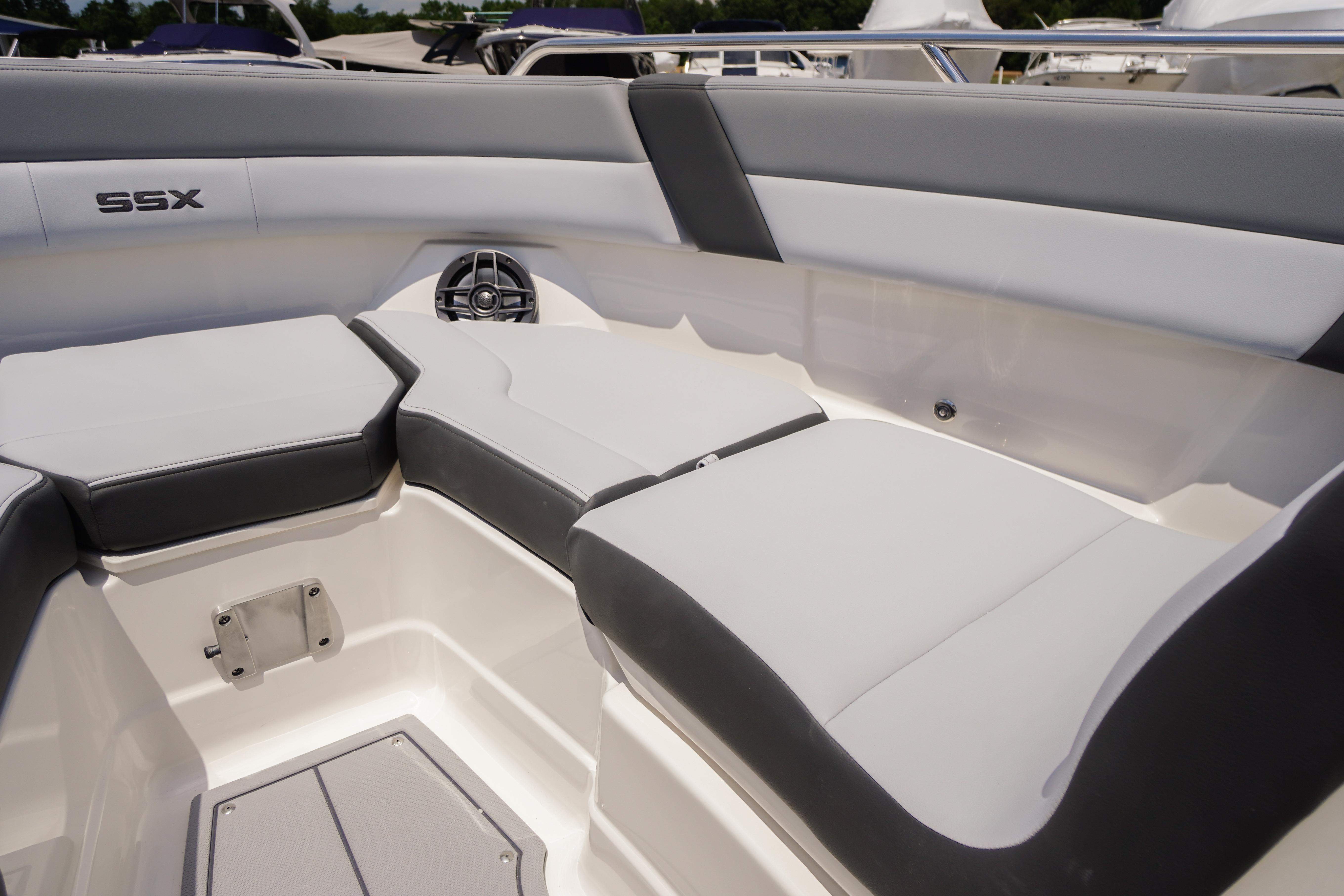 Interior seating of 2026 Chaparral SSX 4 boat, featuring sleek gray and white upholstery.