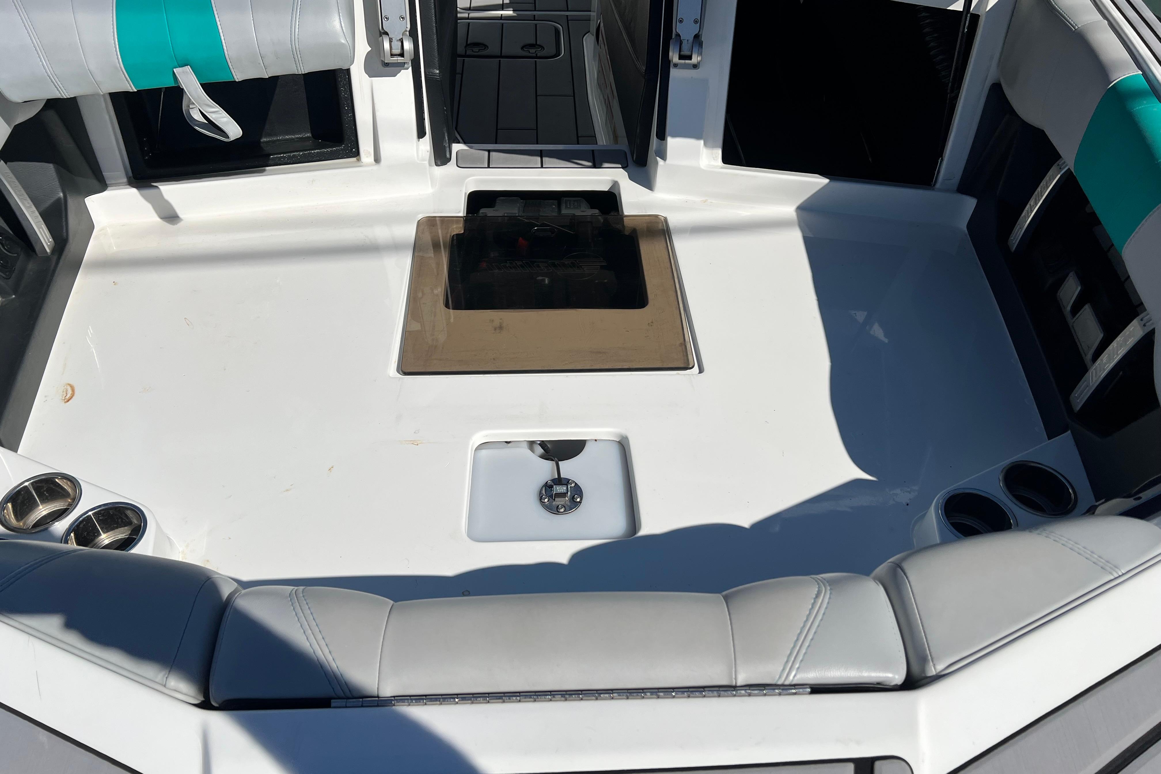 2020 Malibu Wakesetter 23 MXZ boat interior with seating and cup holders.