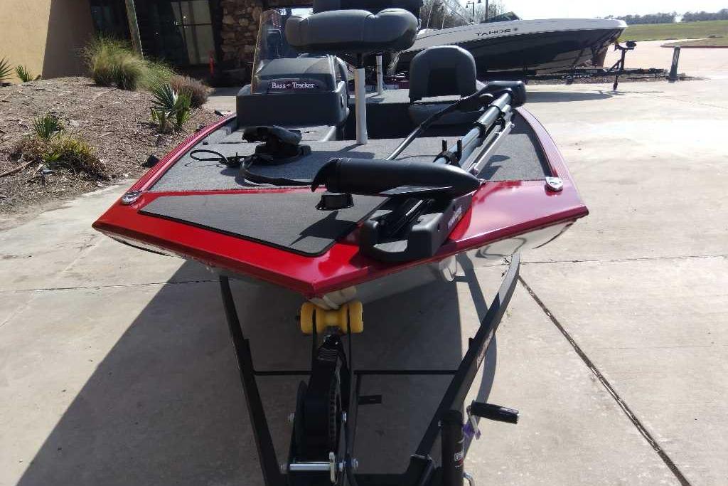 2026 Tracker Bass Tracker Classic XL boat on trailer, red exterior, parked outdoors.