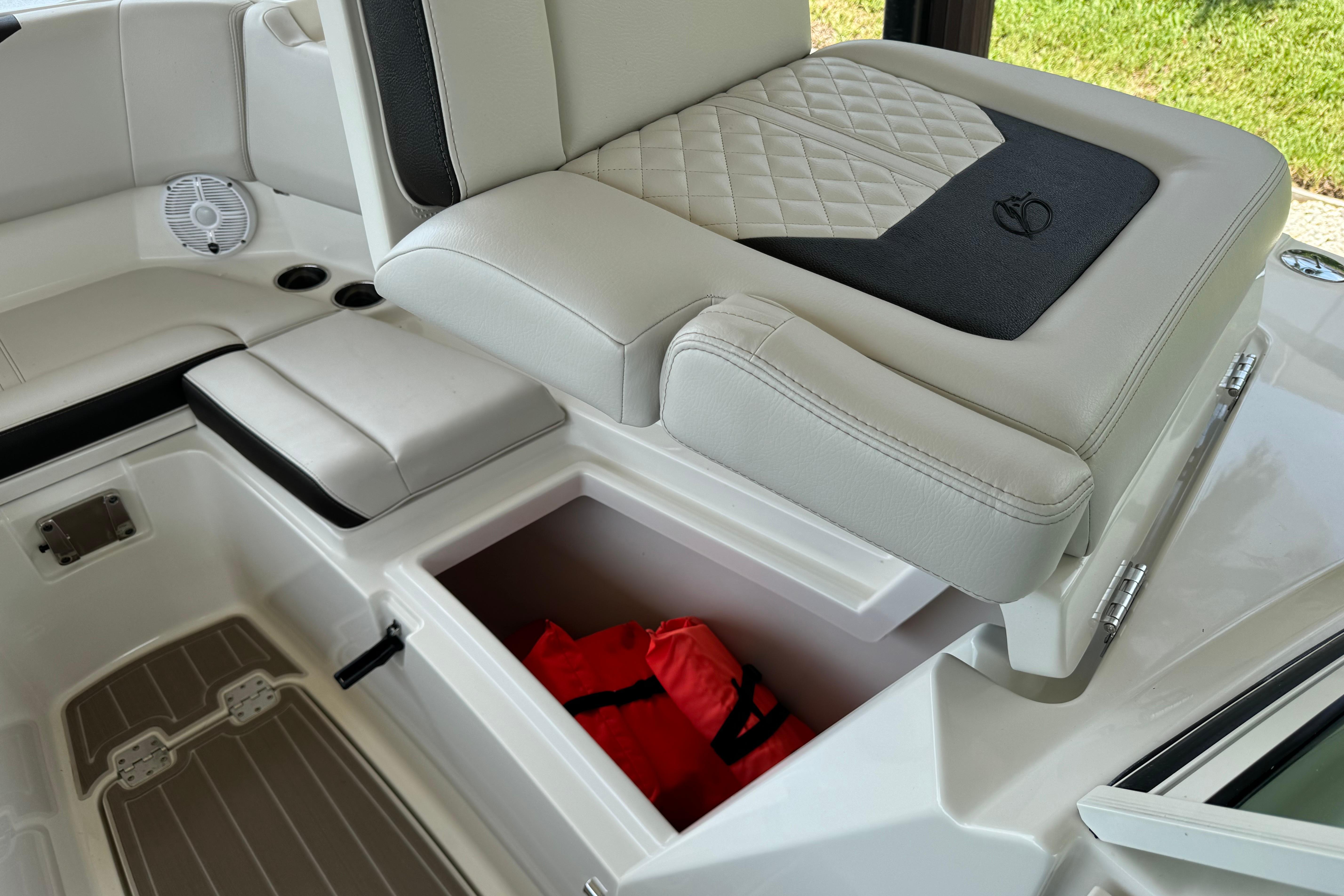 2021 Sailfish 276 DC boat interior with storage compartment and life jacket.