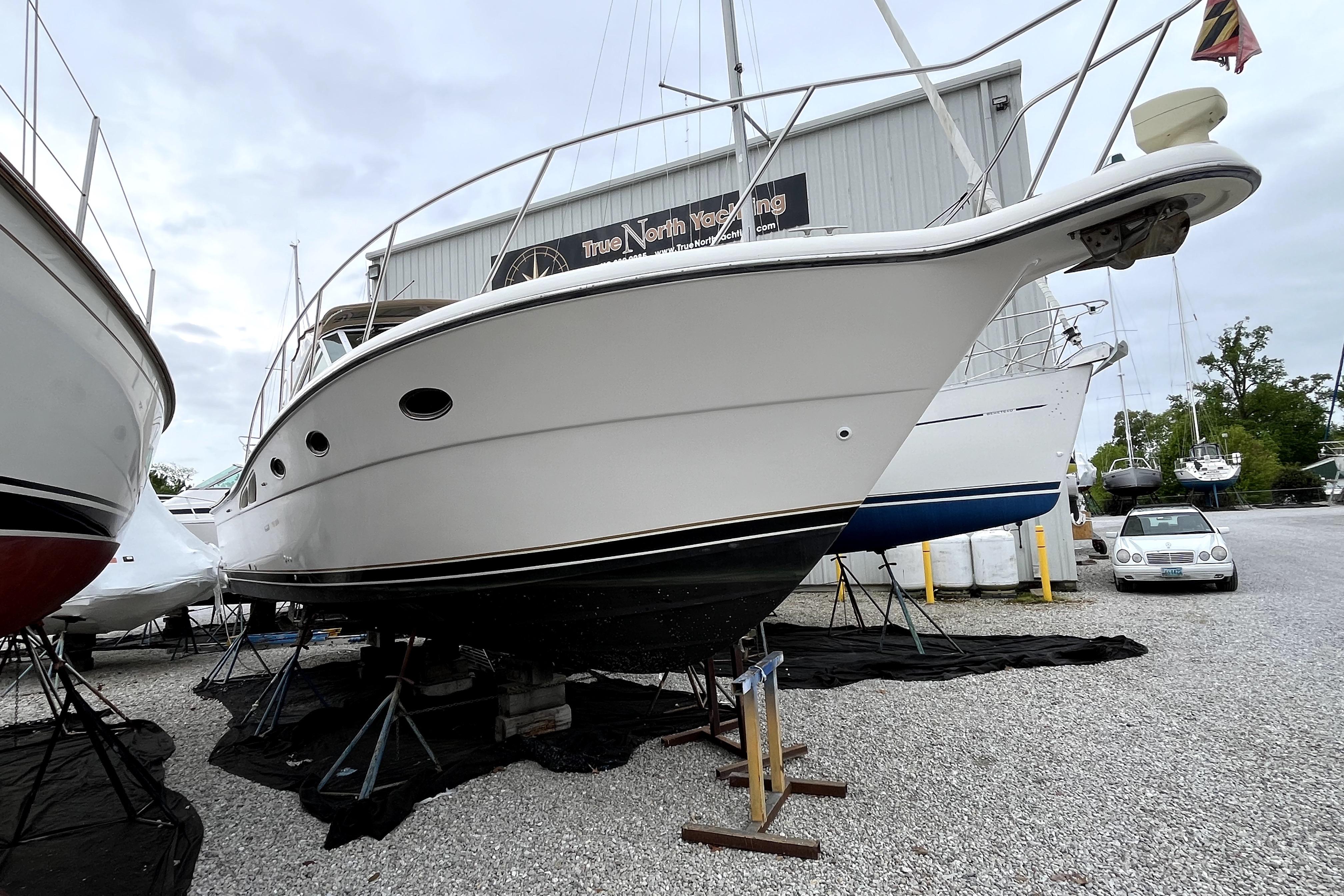 1999 Tiara Yachts 3500 Open on stands at a marina, ready for maintenance.