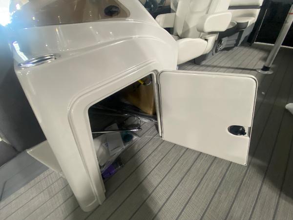 2024 Starcraft EXS 1 boat interior storage compartment with open door.