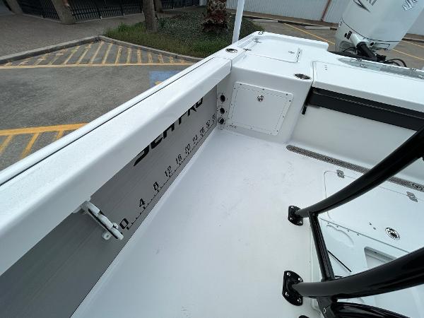 2024 Sea Pro 250 DLX boat interior with measurement markings and storage compartments.