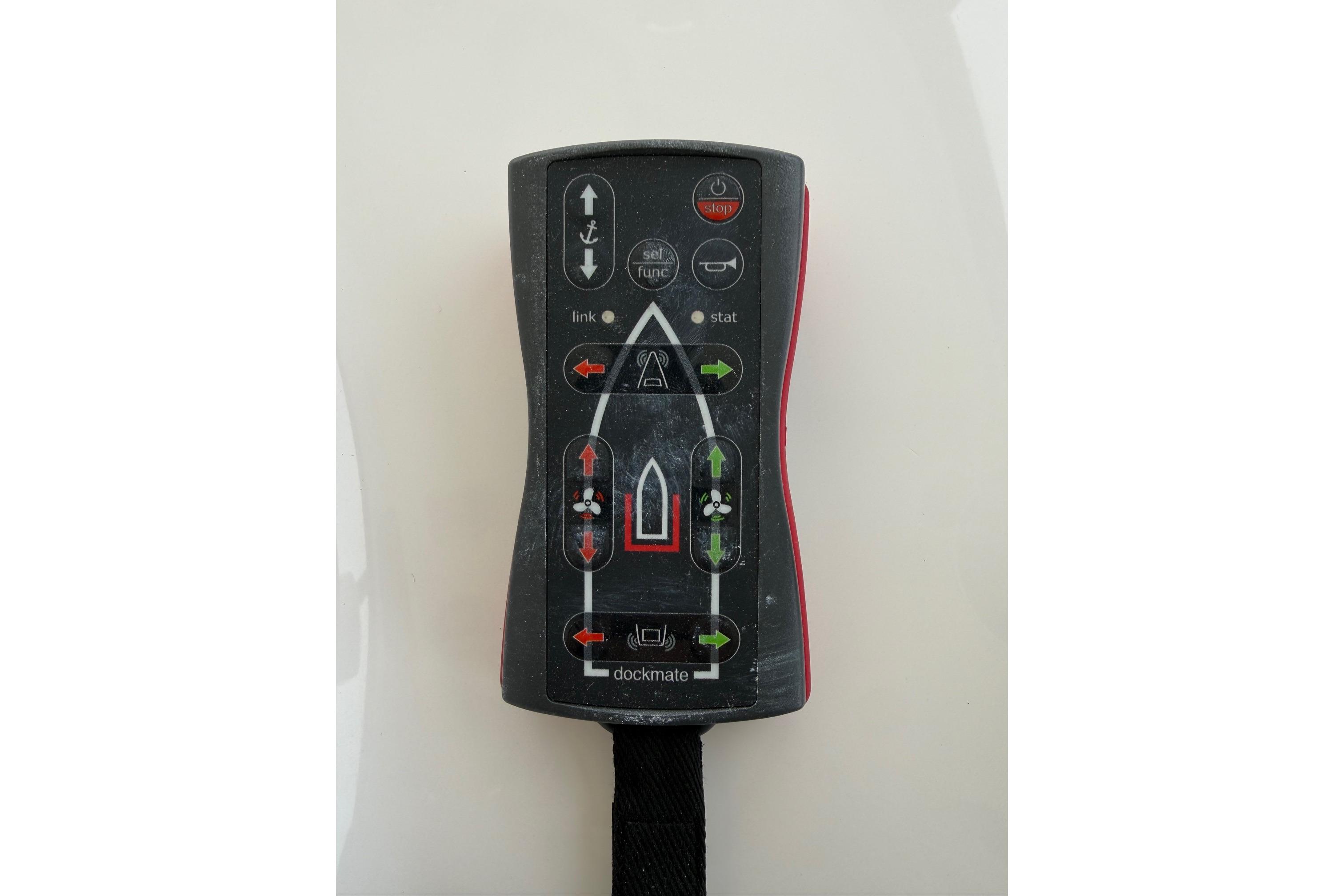 Remote control for 2007 Sea Ray 52 Sedan Bridge yacht, featuring directional buttons and indicators.