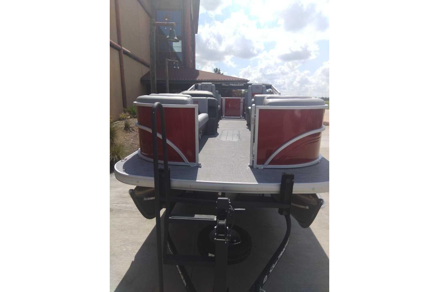 2026 Sun Tracker Party Barge 22 XP3 pontoon boat with red and gray seating.