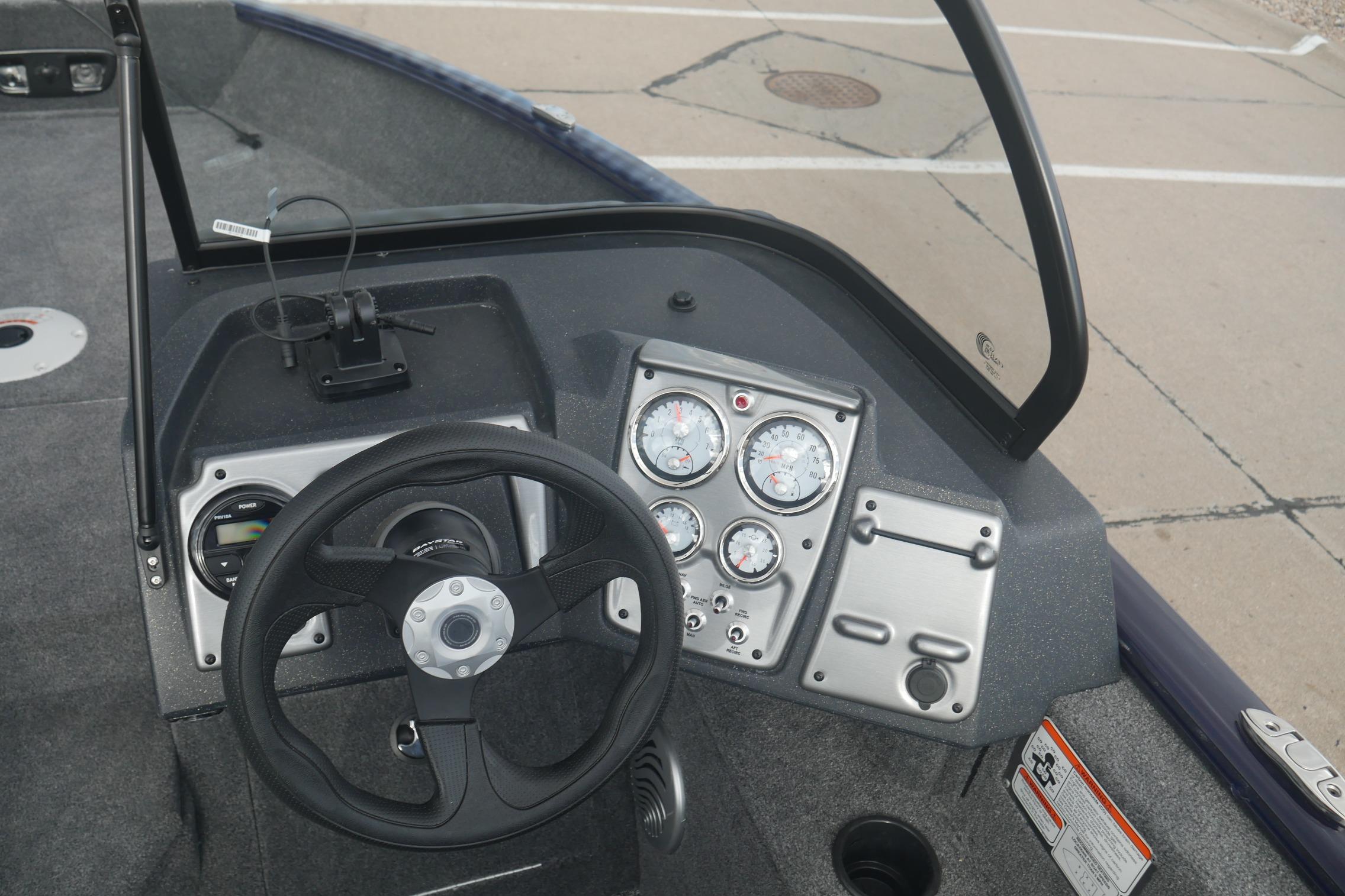 2026 Tracker Pro Guide V-175 Combo boat dashboard with steering wheel and gauges.