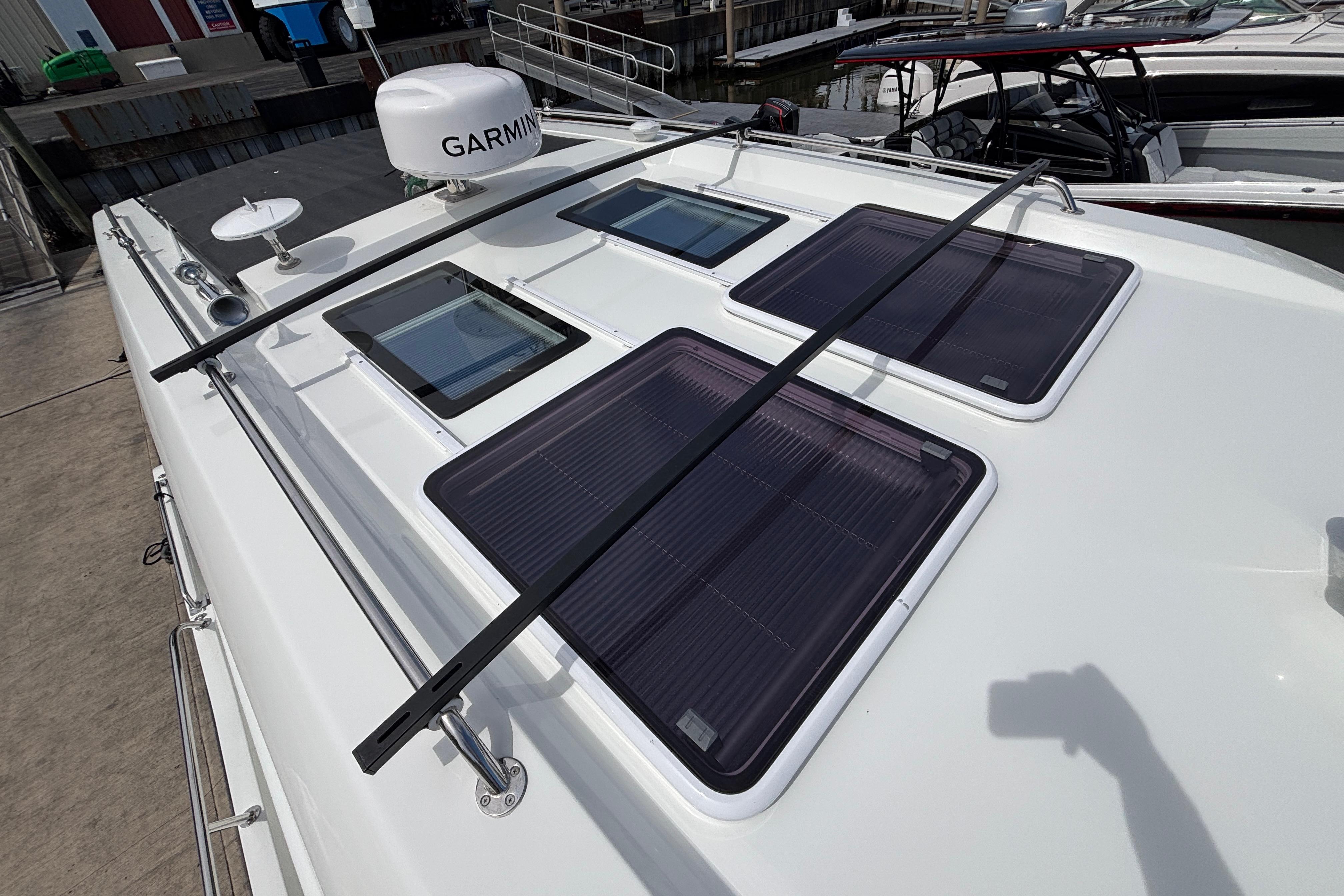 2024 Beneteau Antares 11 boat roof with solar panels and Garmin equipment.