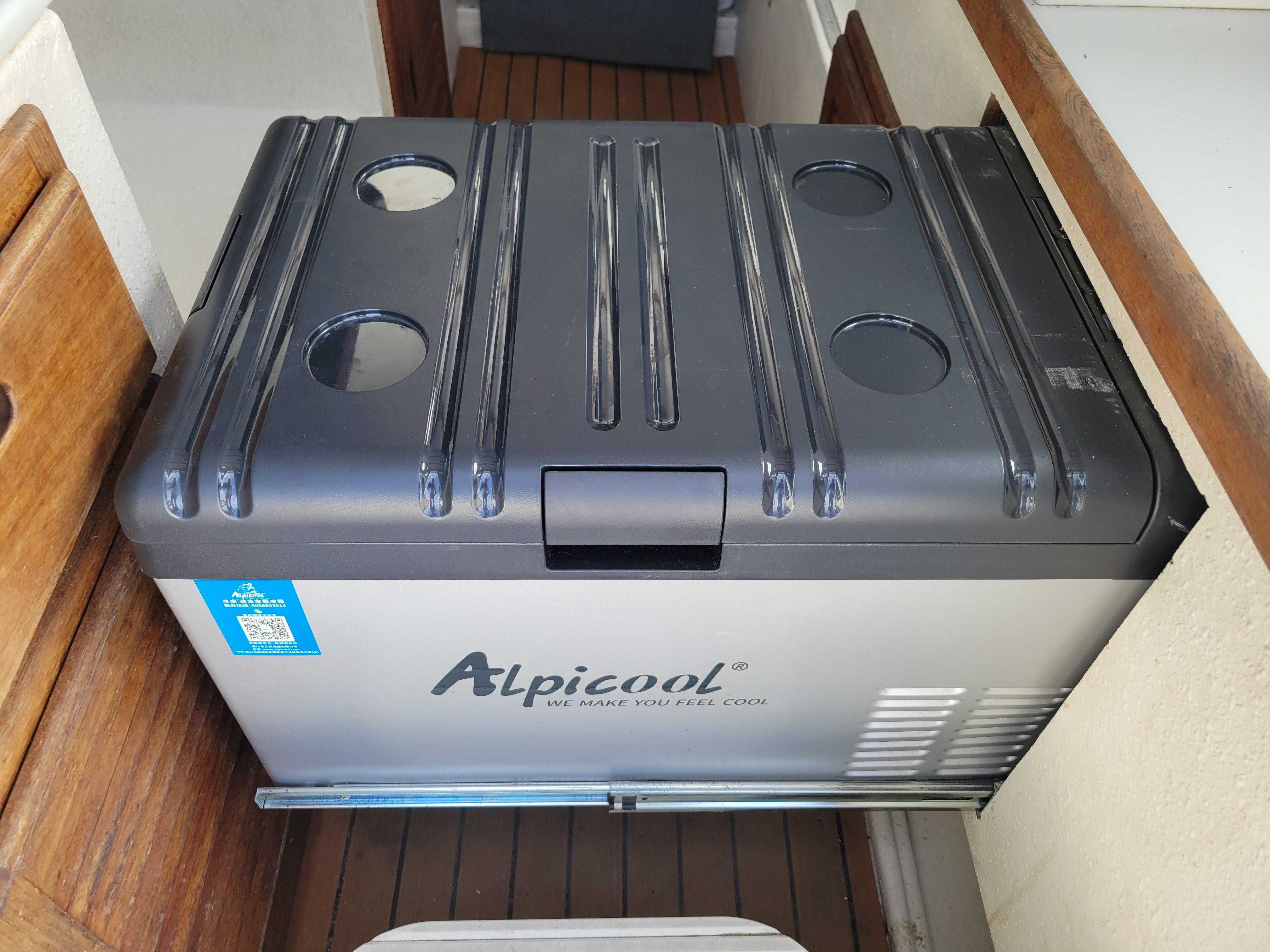 Alpicool cooler inside a 1999 SeaSport 2400 XL Limited boat, featuring a sleek design.