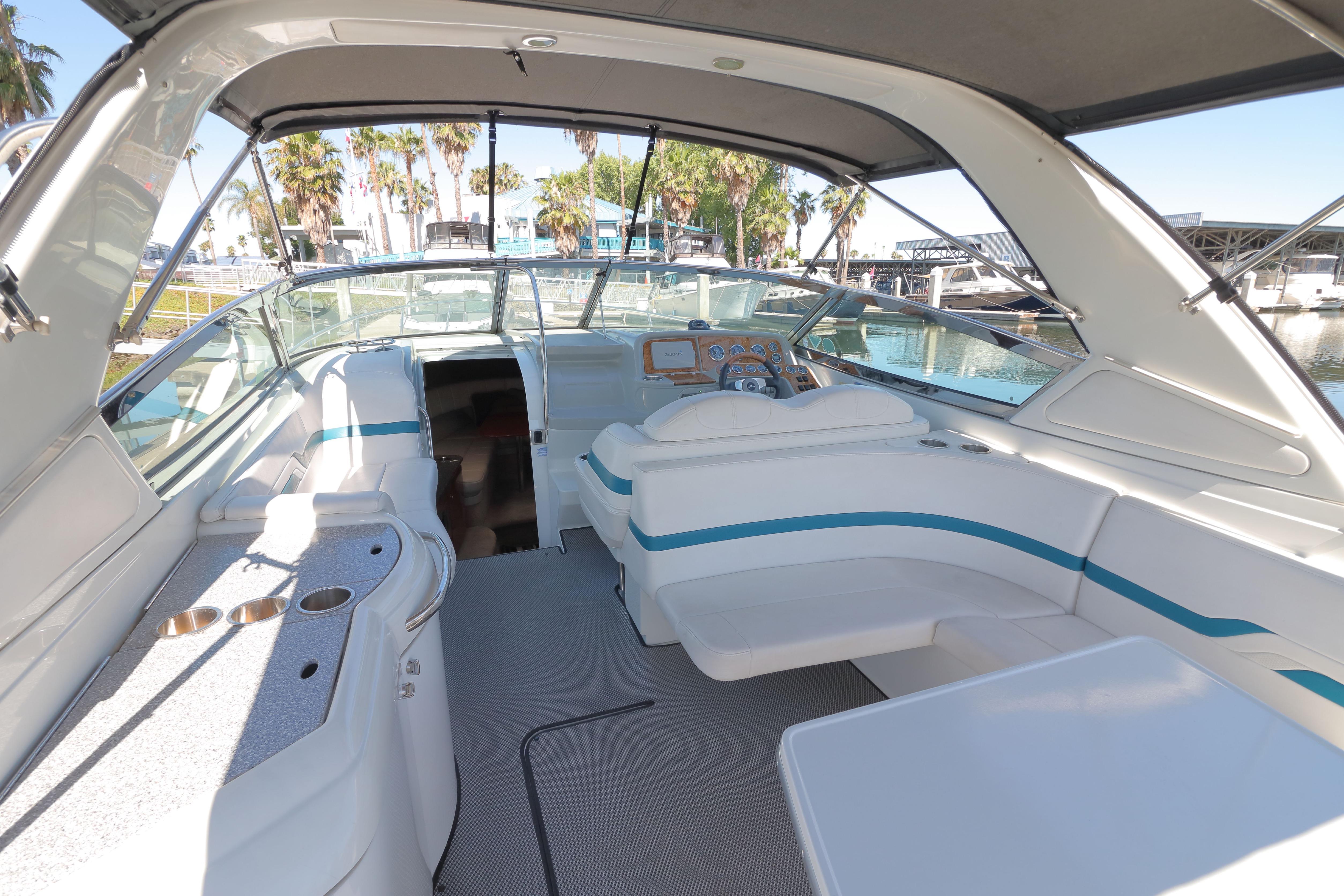 2006 Formula 330 Sun Sport boat interior with seating and helm, docked at marina.