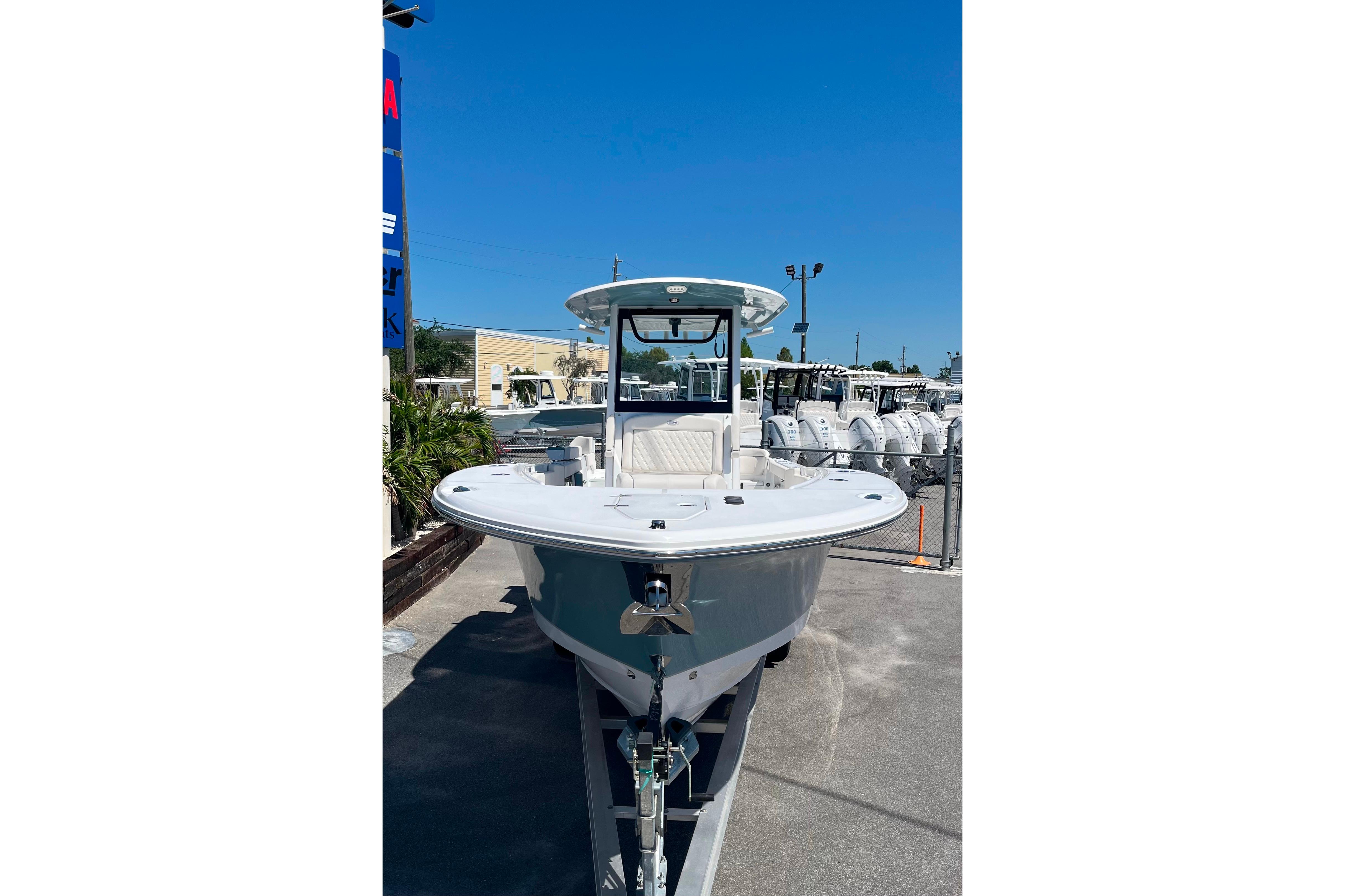 2026 Sea Hunt Ultra 275 Coffin Box boat displayed outdoors under clear blue sky.