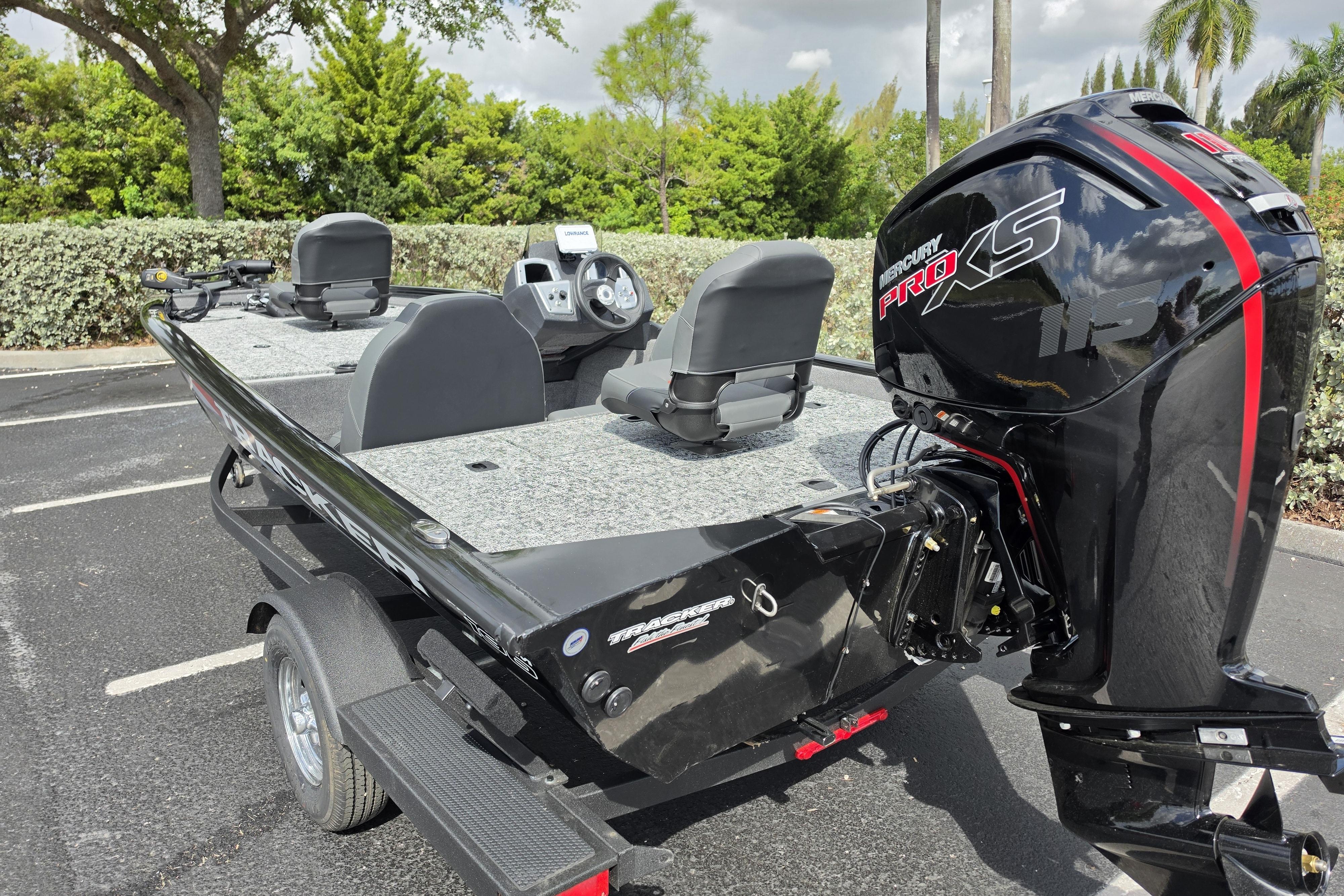 2026 Tracker Pro Team 190 boat with Mercury Pro XS engine in parking lot.