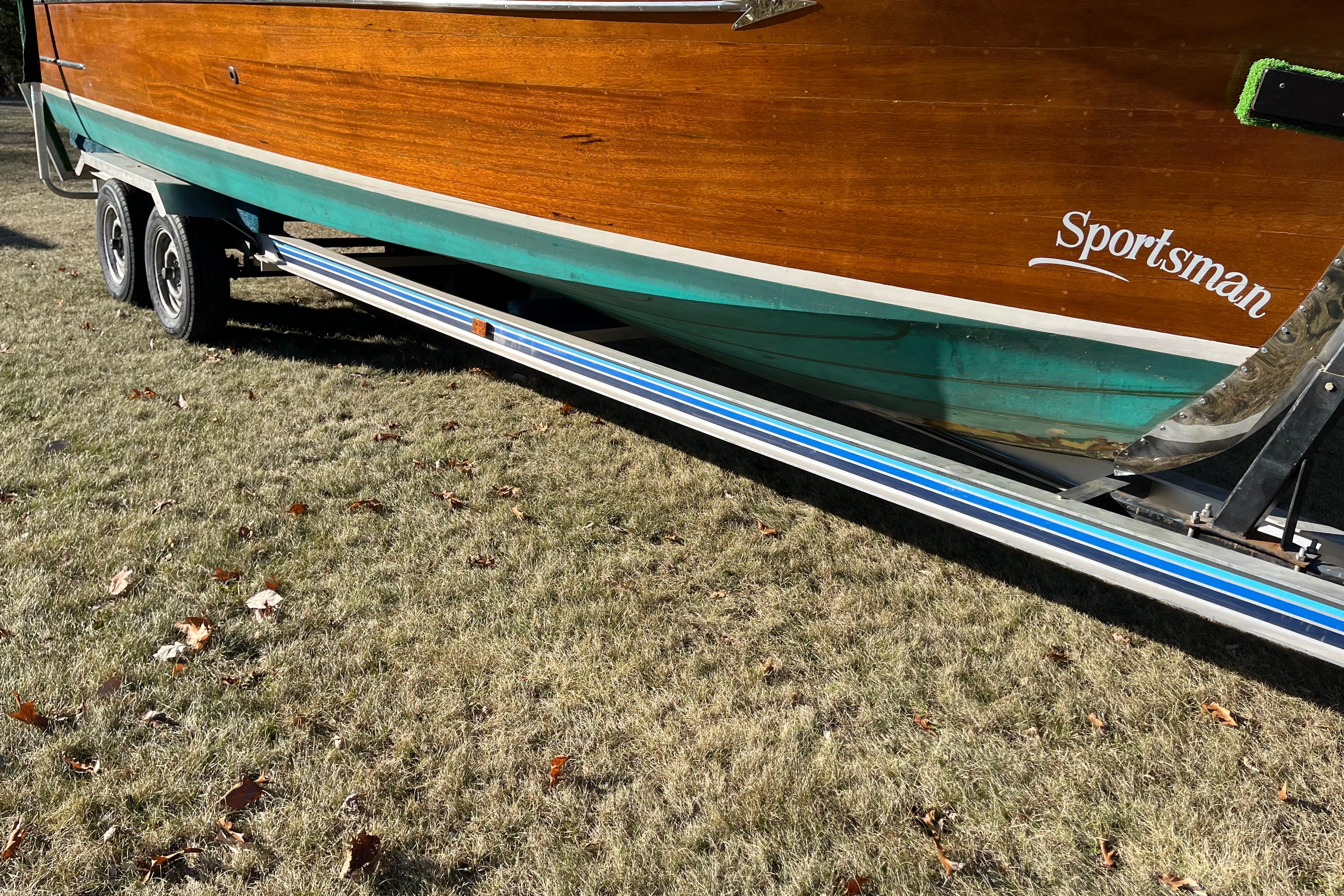 1938 Chris-Craft 28 Sportsman boat on trailer, showcasing wooden hull and vintage design.