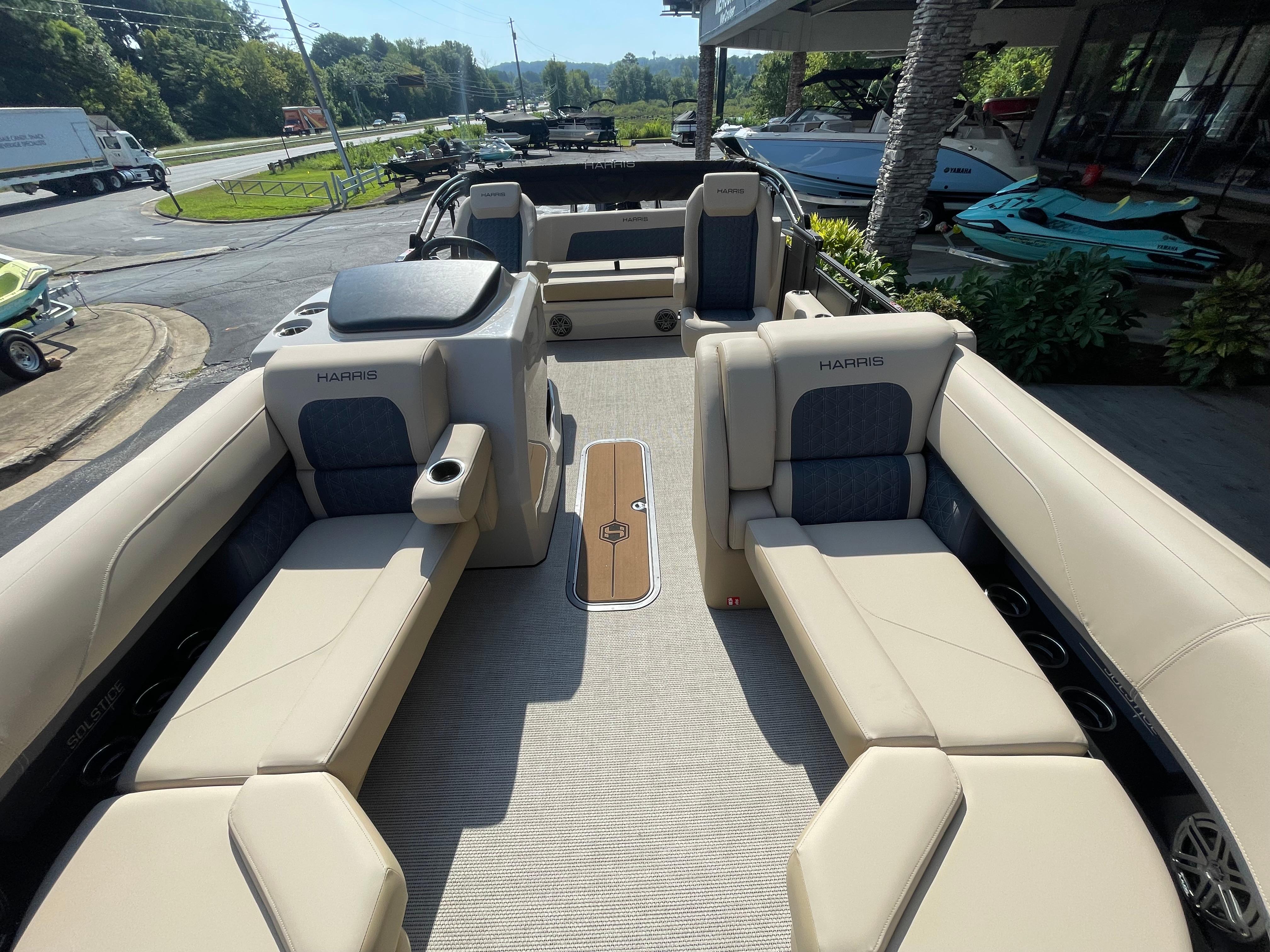 2026 Harris Solstice 230 pontoon boat interior with beige seating and modern design.