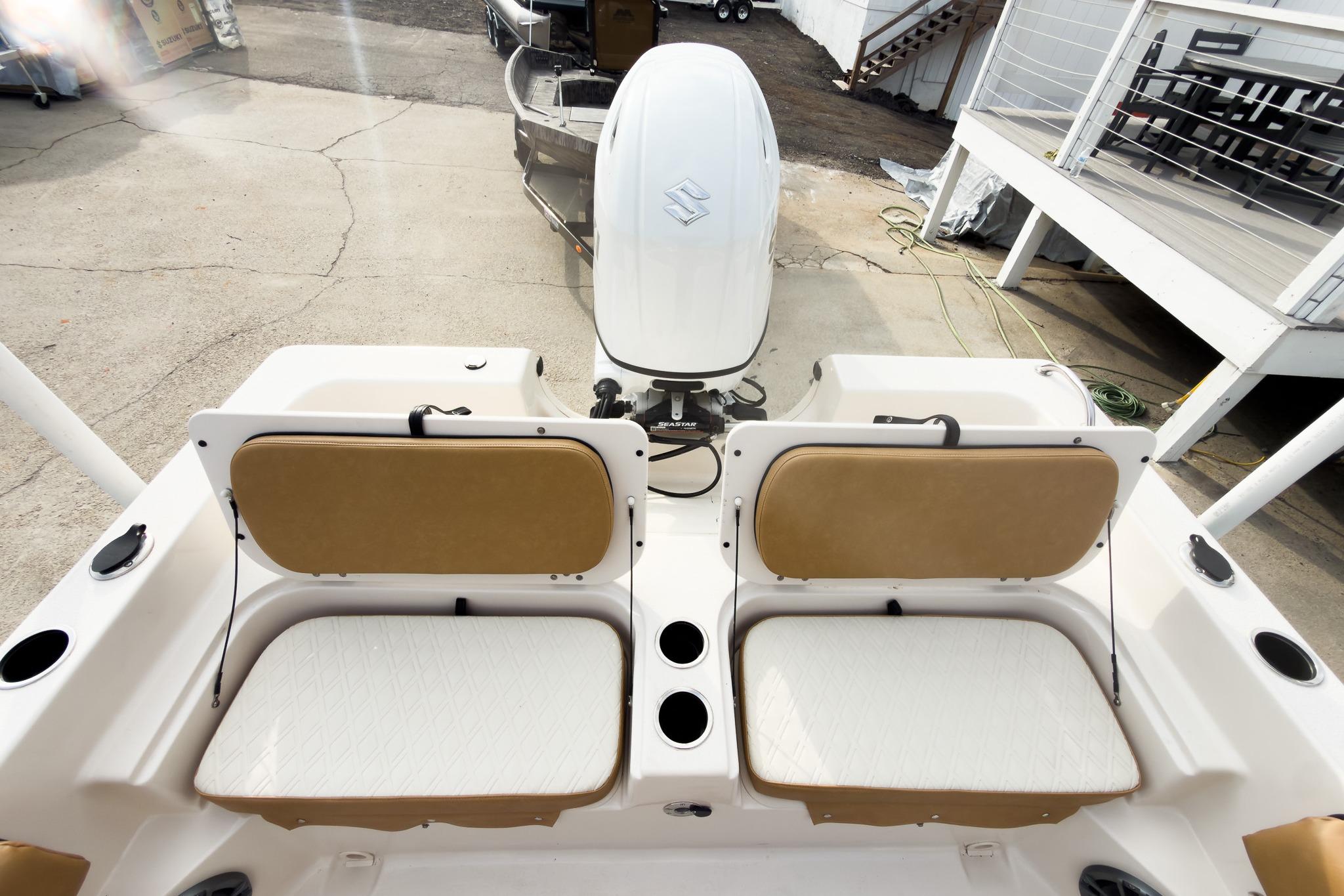 2025 Carolina Skiff 21 Ultra Elite boat with dual seats and outboard motor.