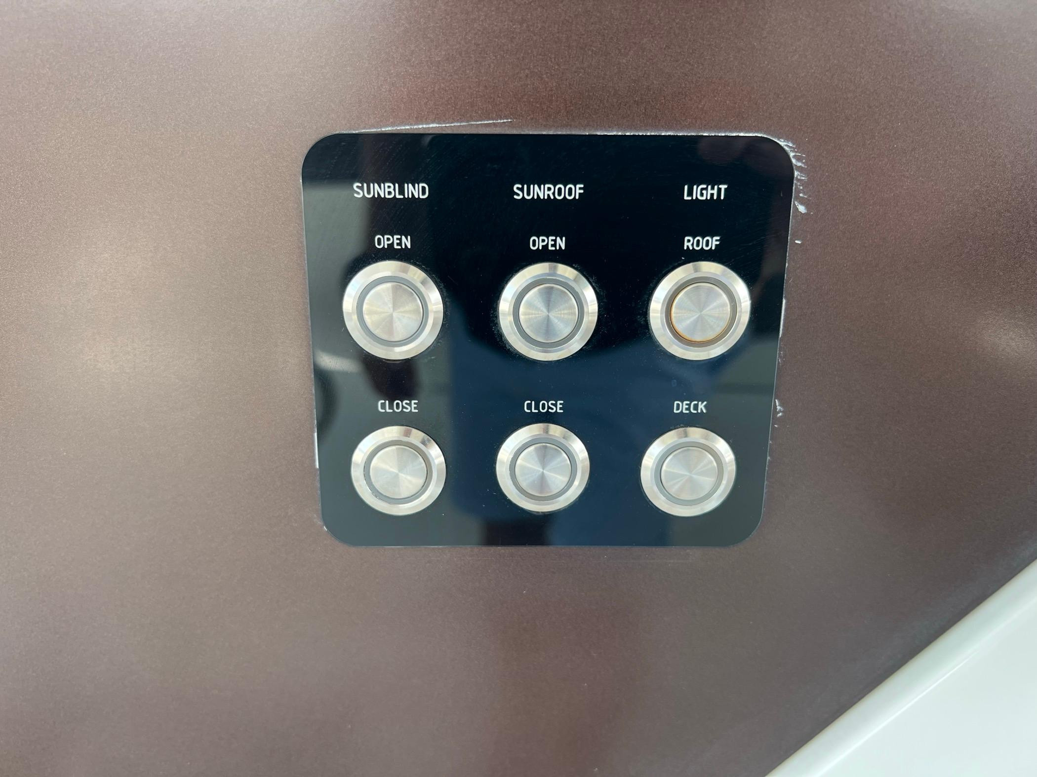 Control panel on 2020 Galeon 680 Fly yacht for sunblind, sunroof, and light adjustments.