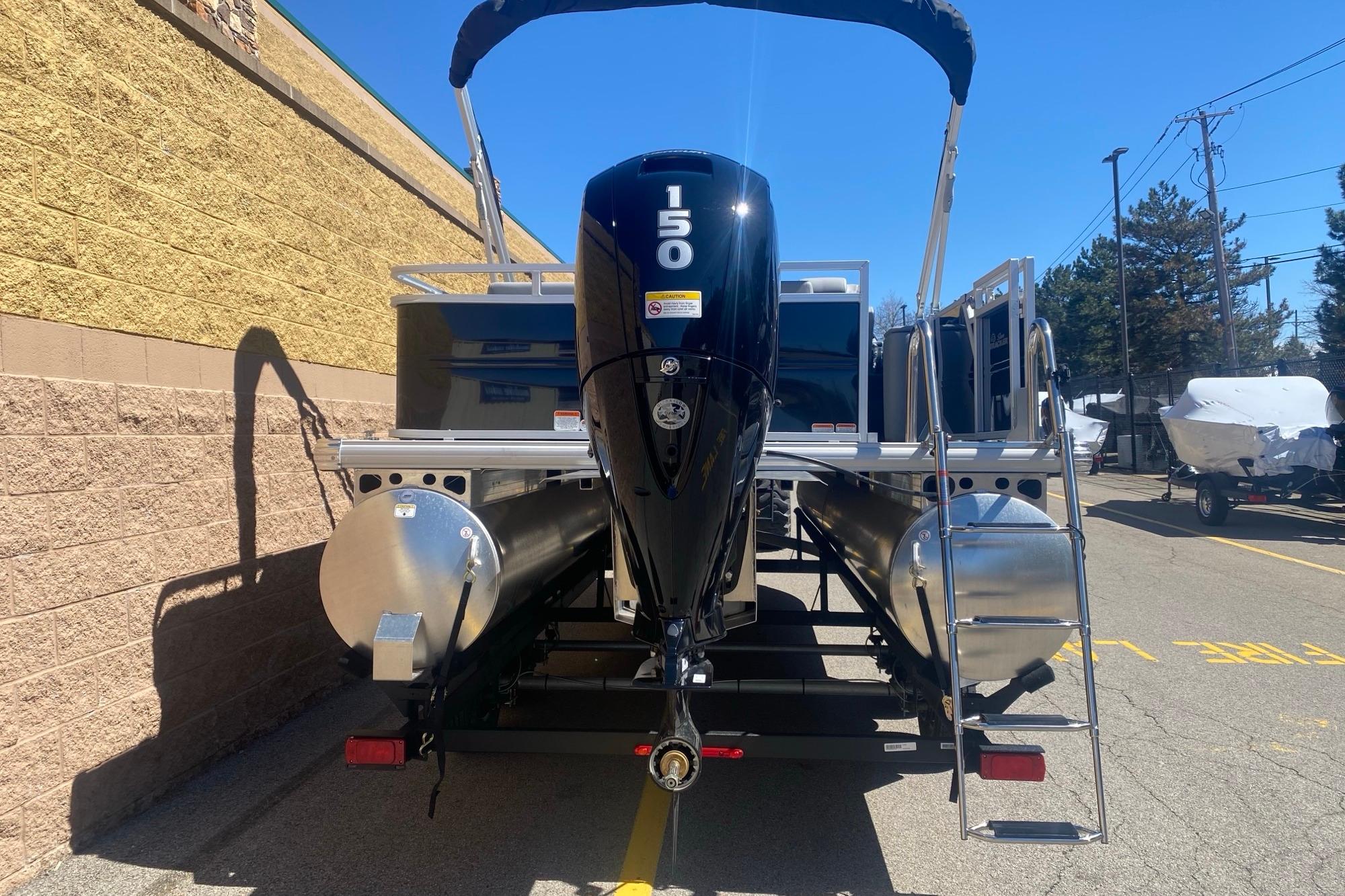 2026 Sun Tracker Party Barge 22 RF DLX pontoon boat with 150 HP engine.
