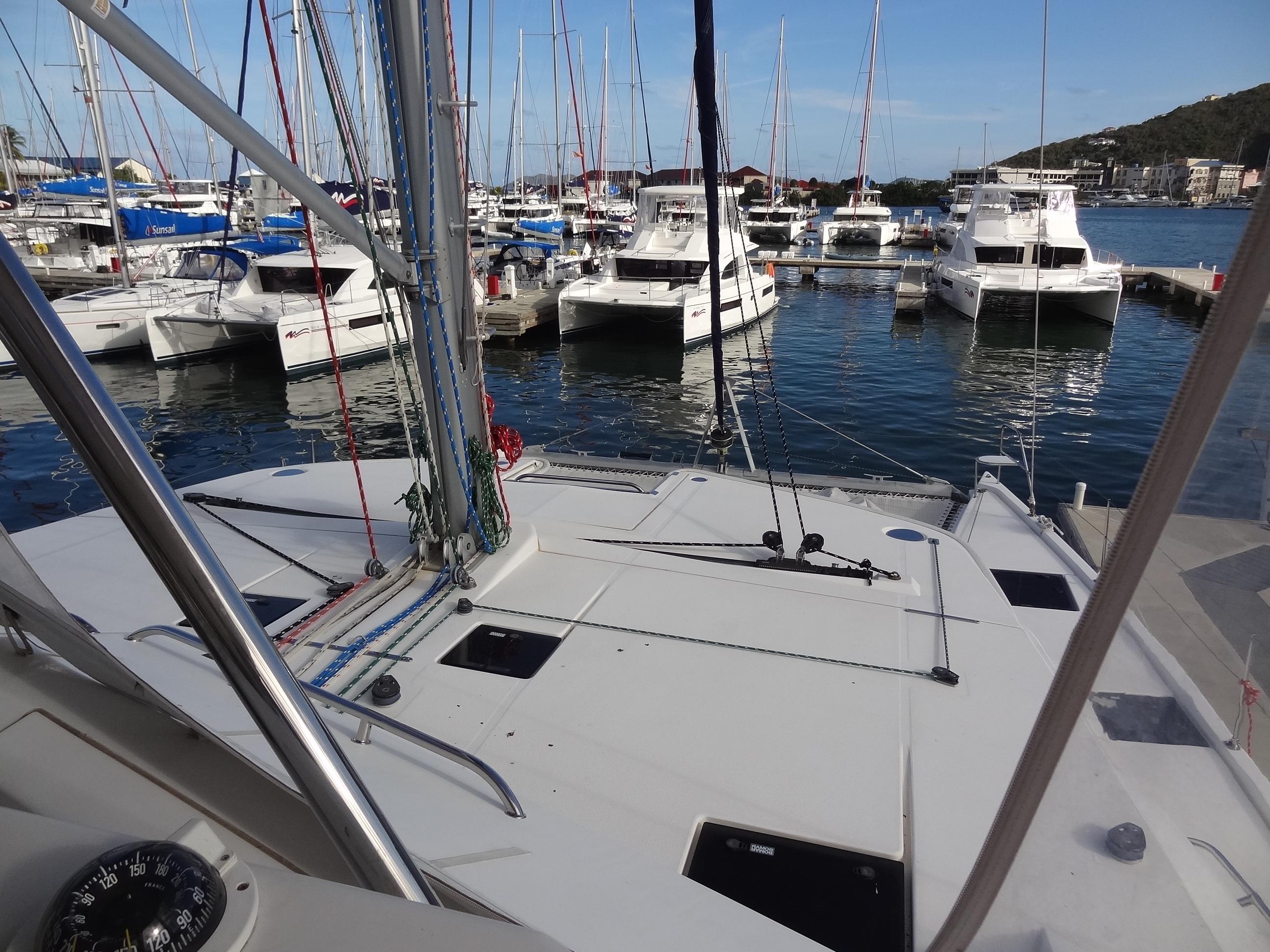 View from Leopard 58 catamaran, 2014 model, docked at a marina with other boats.