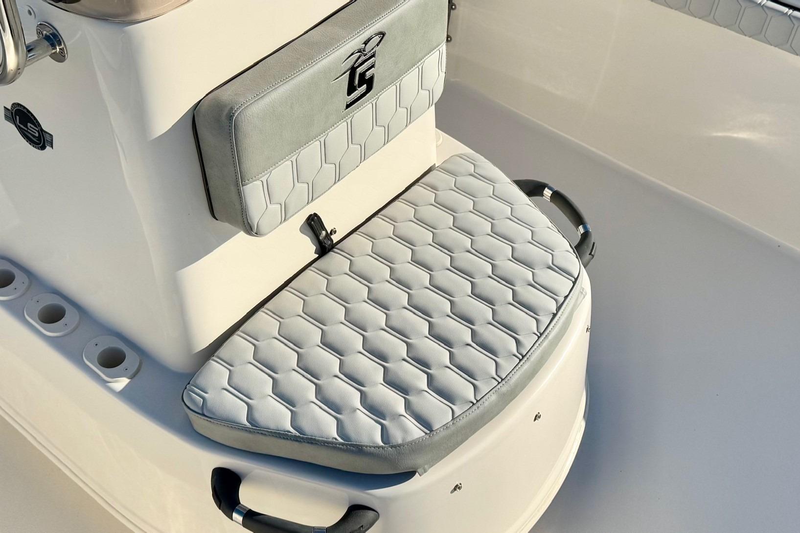 2025 Carolina Skiff 21 LS boat seat with hexagonal pattern and logo detail.