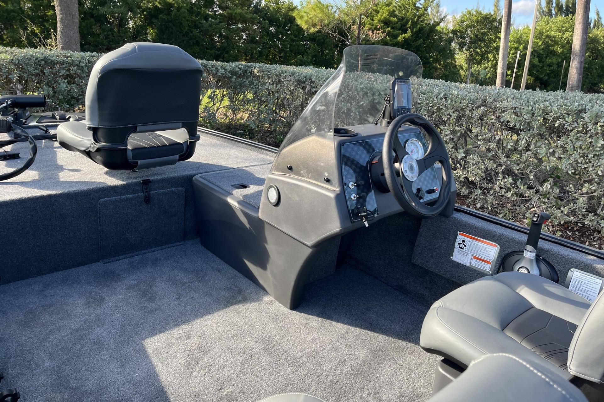 2026 Tracker Bass Tracker Classic XL boat interior with steering console and seating.