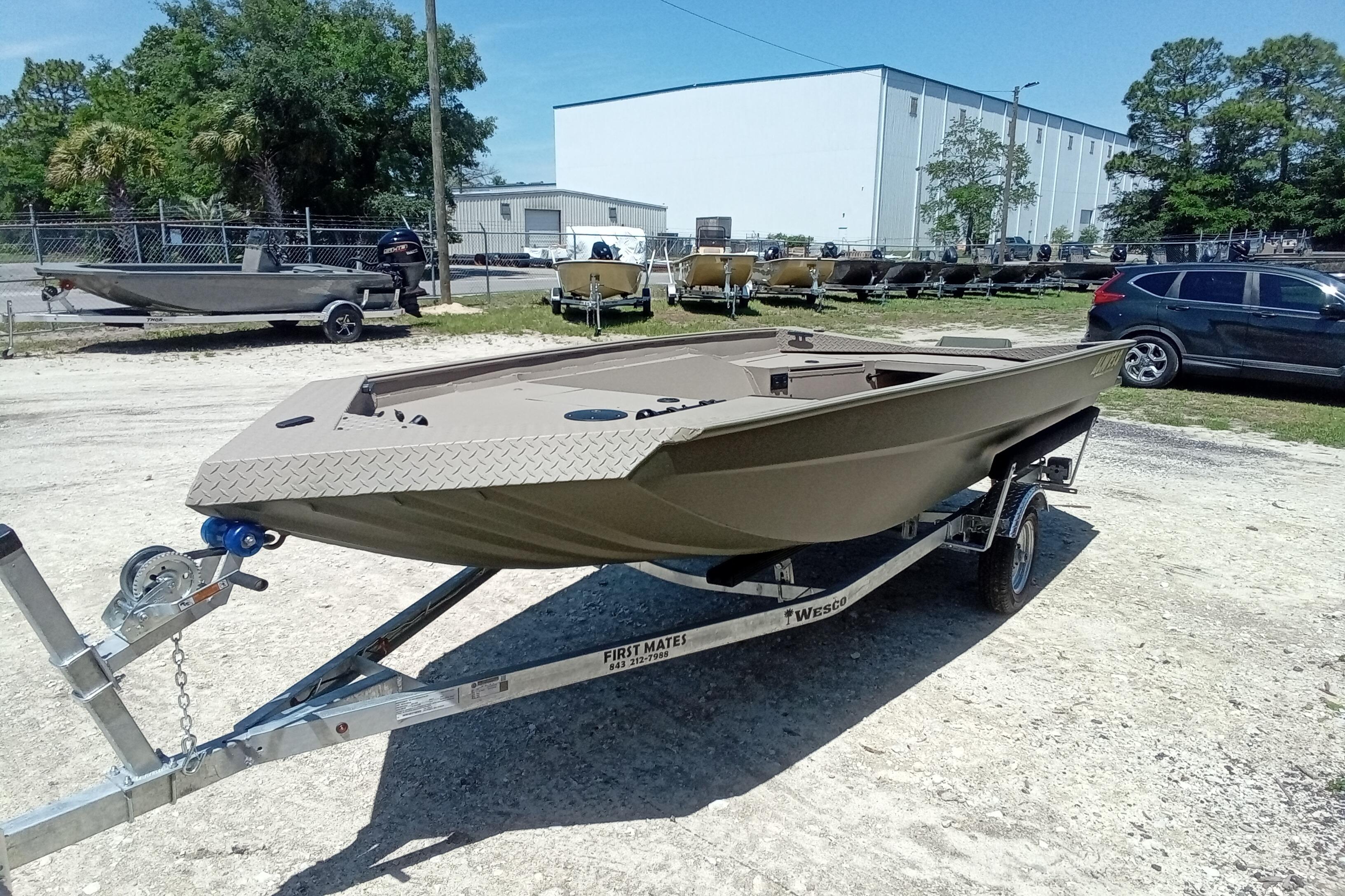 2026 Alweld 1652 Invader boat on trailer in outdoor lot.