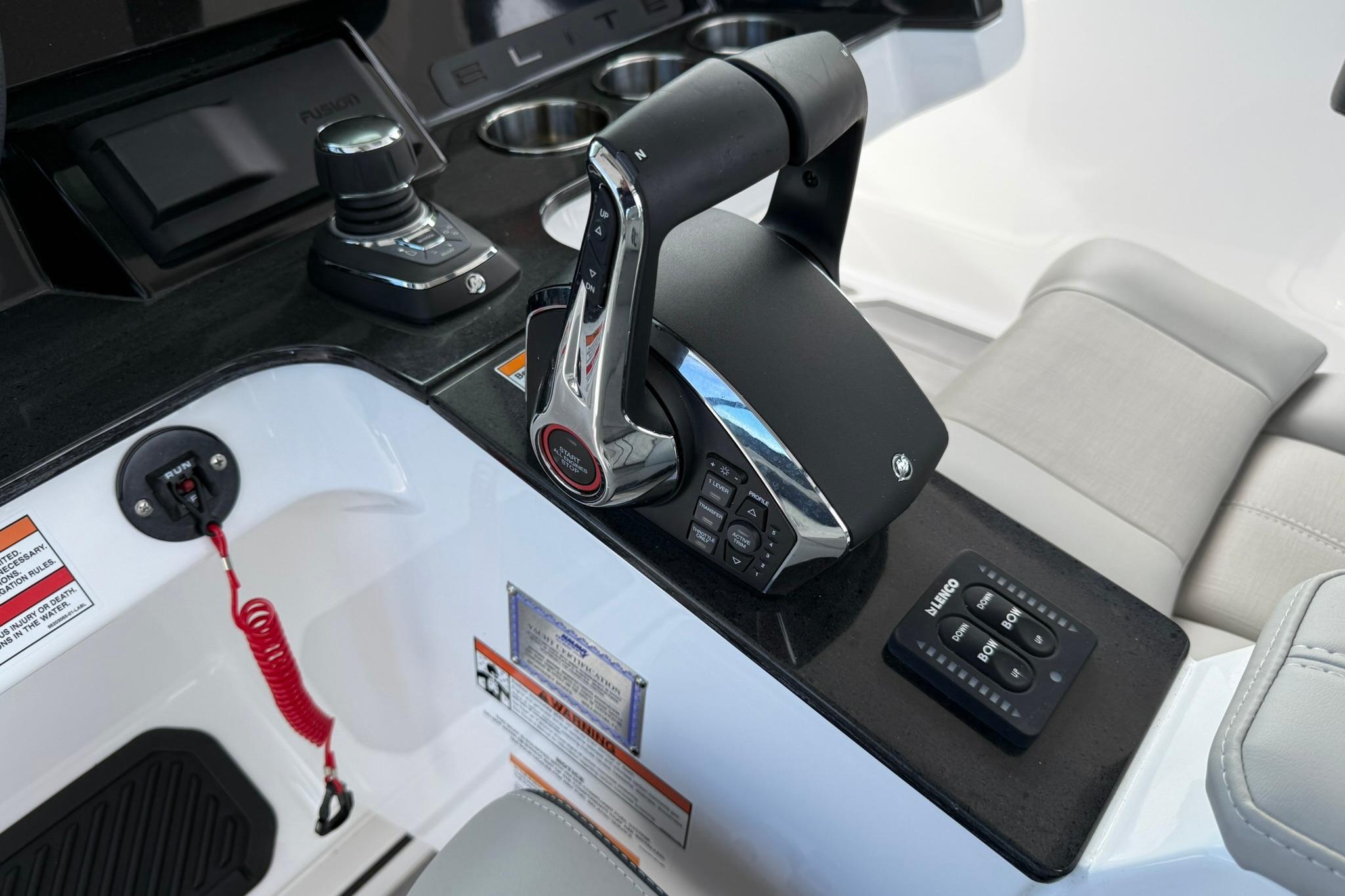 Control panel of 2027 Monterey Elite 30 OB boat with joystick and throttle.