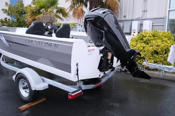 2024 Crestliner 1600 Vision boat on trailer, featuring outboard motor.