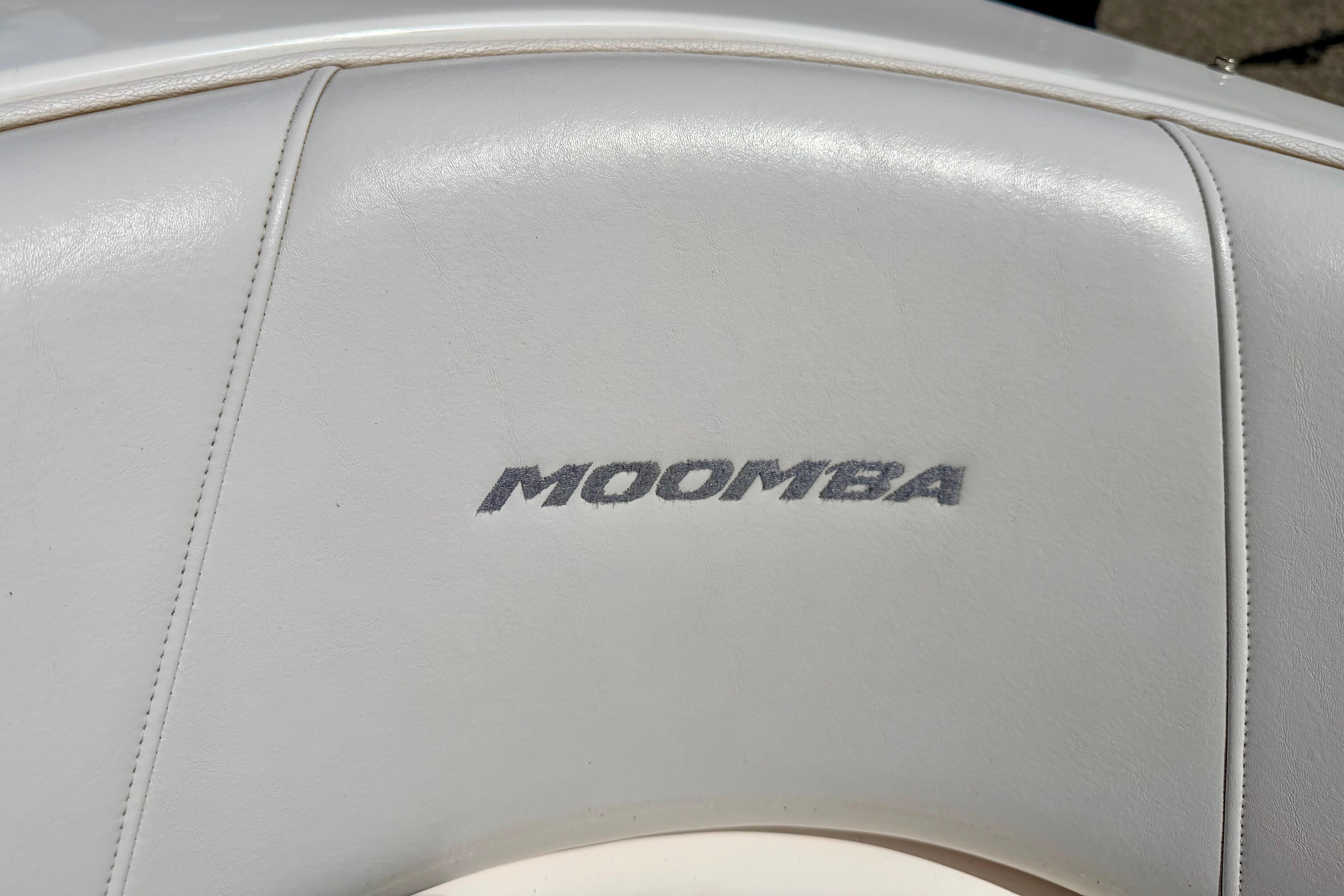 Moomba Outback V 2008 boat seat with logo, featuring white upholstery.