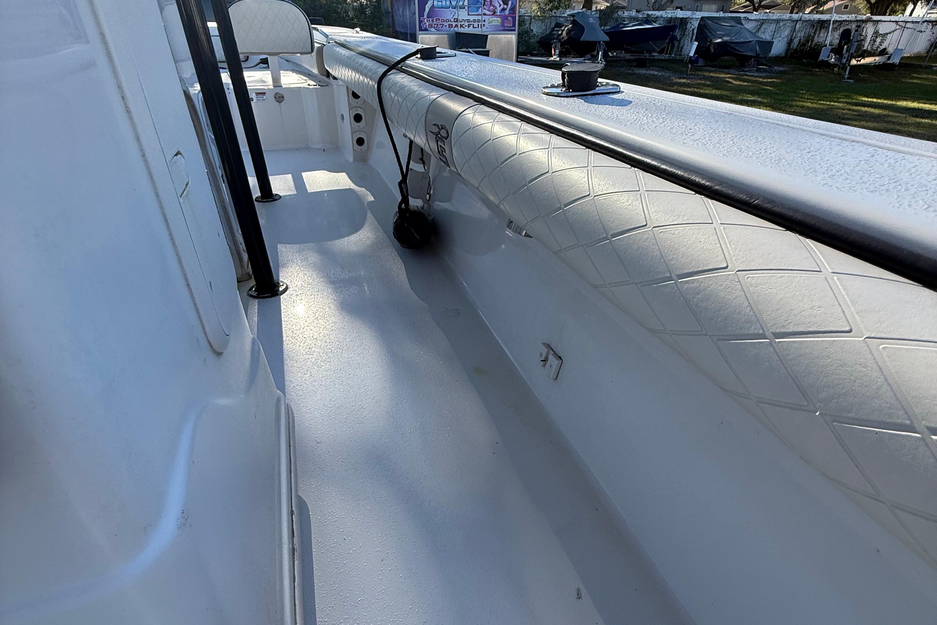 2021 Carolina Skiff 26 Ultra Elite boat interior with white textured flooring and seating.