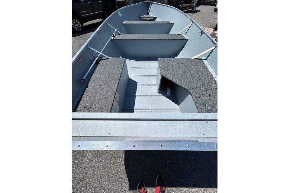 2027 Lund WC 16 boat interior with gray seating and storage compartments.