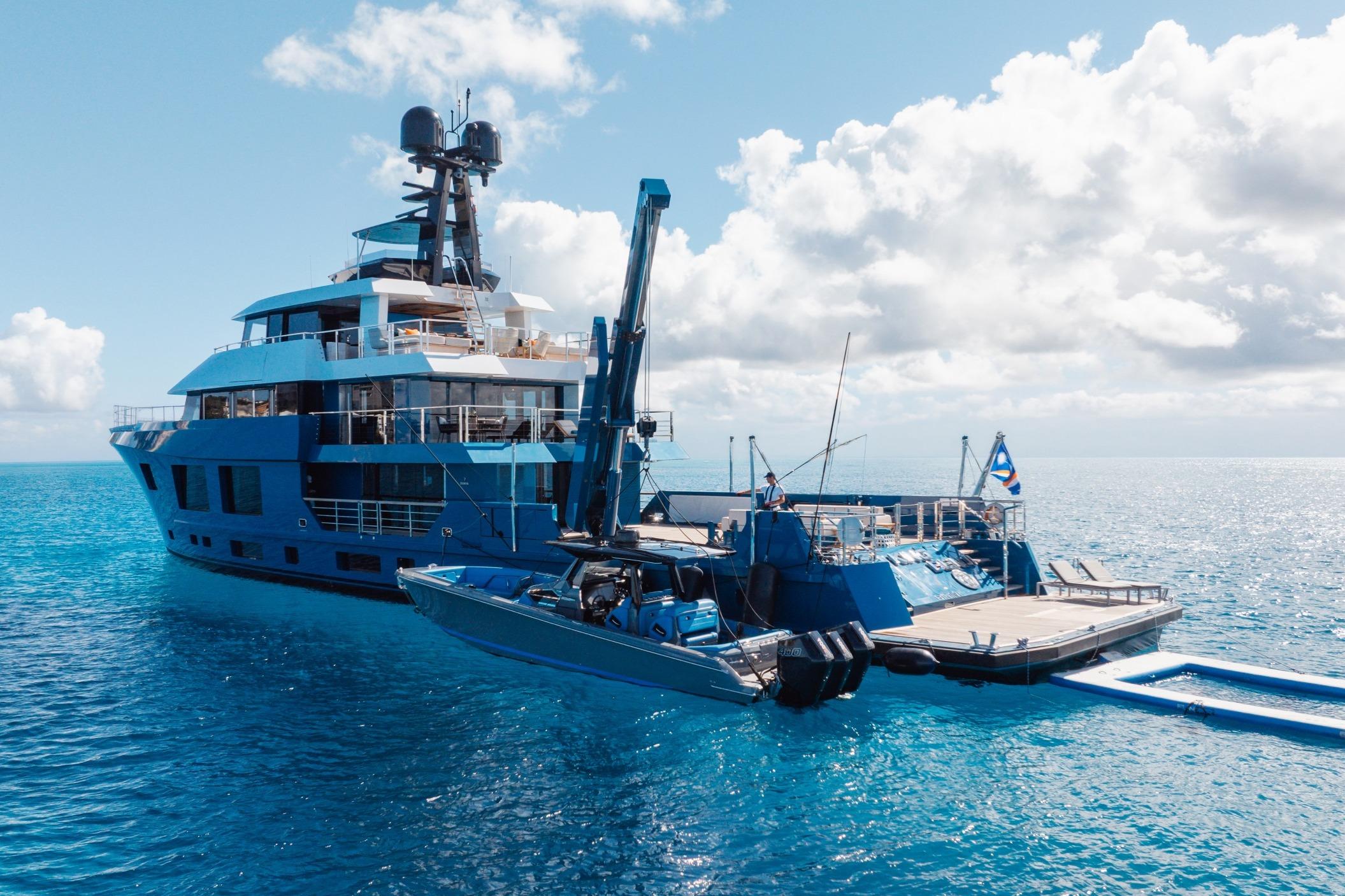 Luxury 2024 Dunya Yachts Explorer on serene ocean, featuring sleek design and modern amenities.