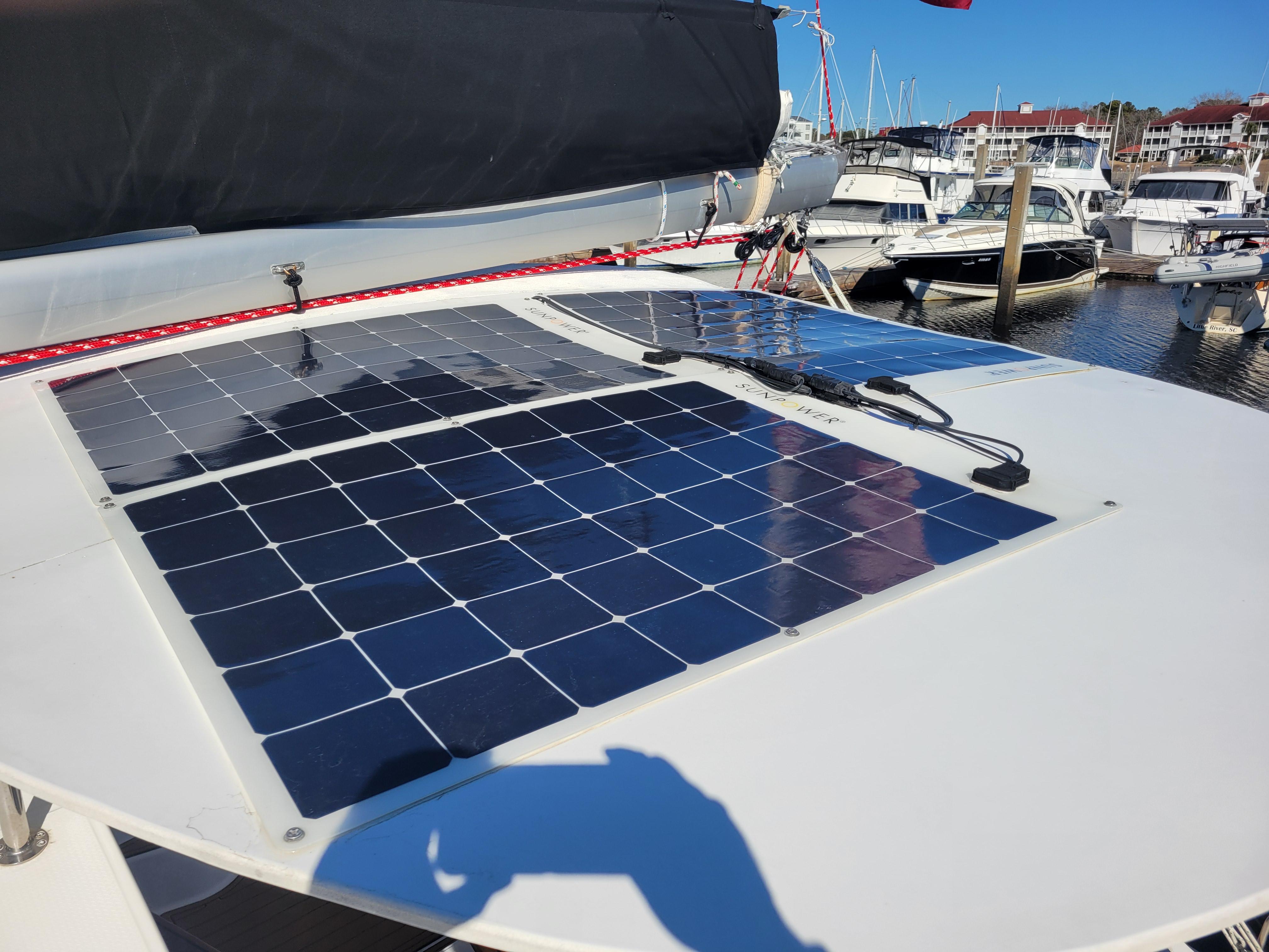 Solar panels on 2006 Fountaine Pajot LAVEZZI catamaran docked at marina.