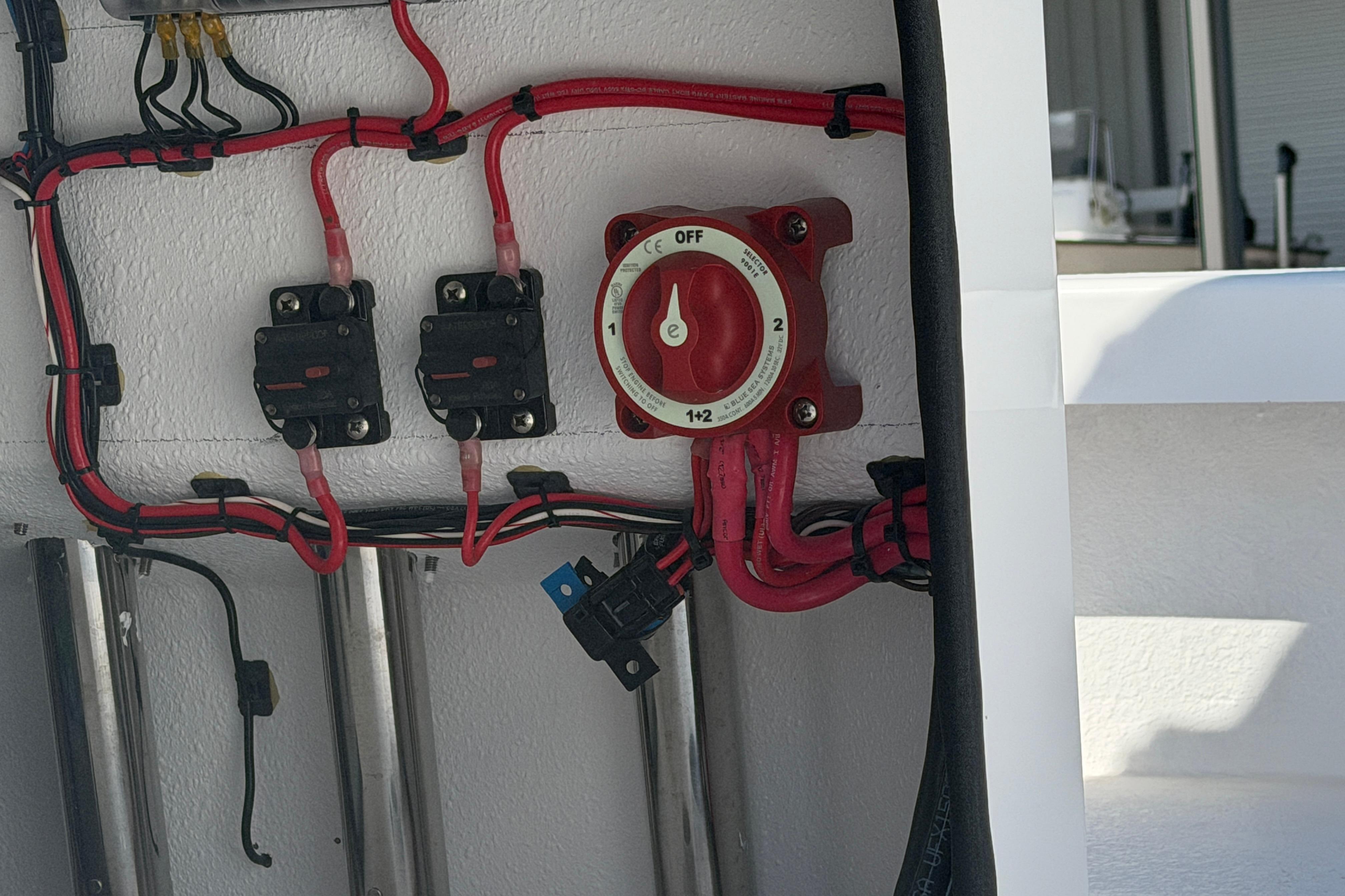 Electrical wiring and switch panel on a 2026 Skuta 24 Cat boat.