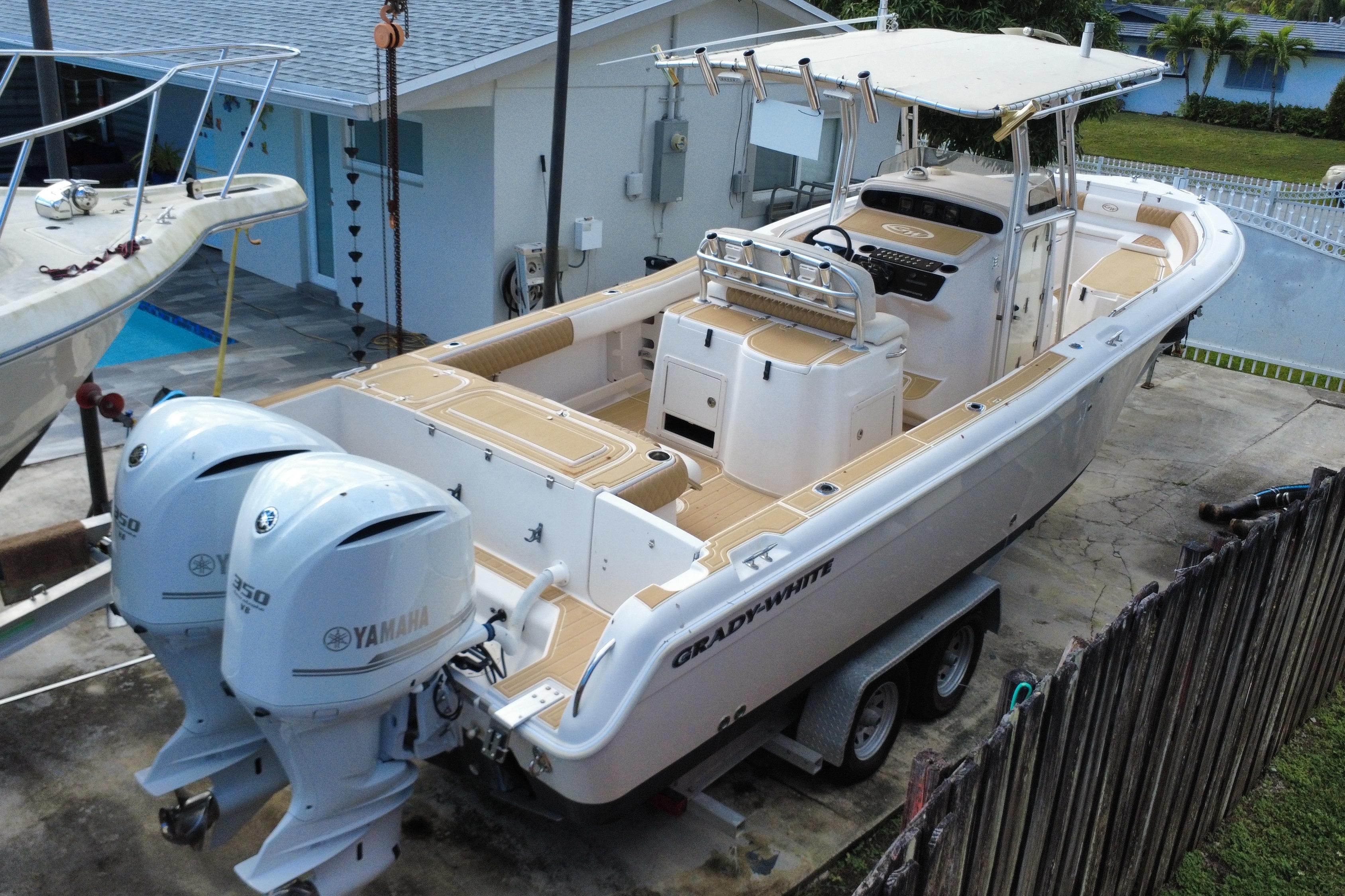 2004 Grady-White Canyon 283 boat with twin Yamaha engines on a trailer.
