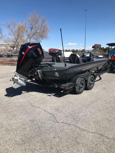 2025 Ranger ALPHA 208 boat with outboard motor on a trailer in a parking lot.