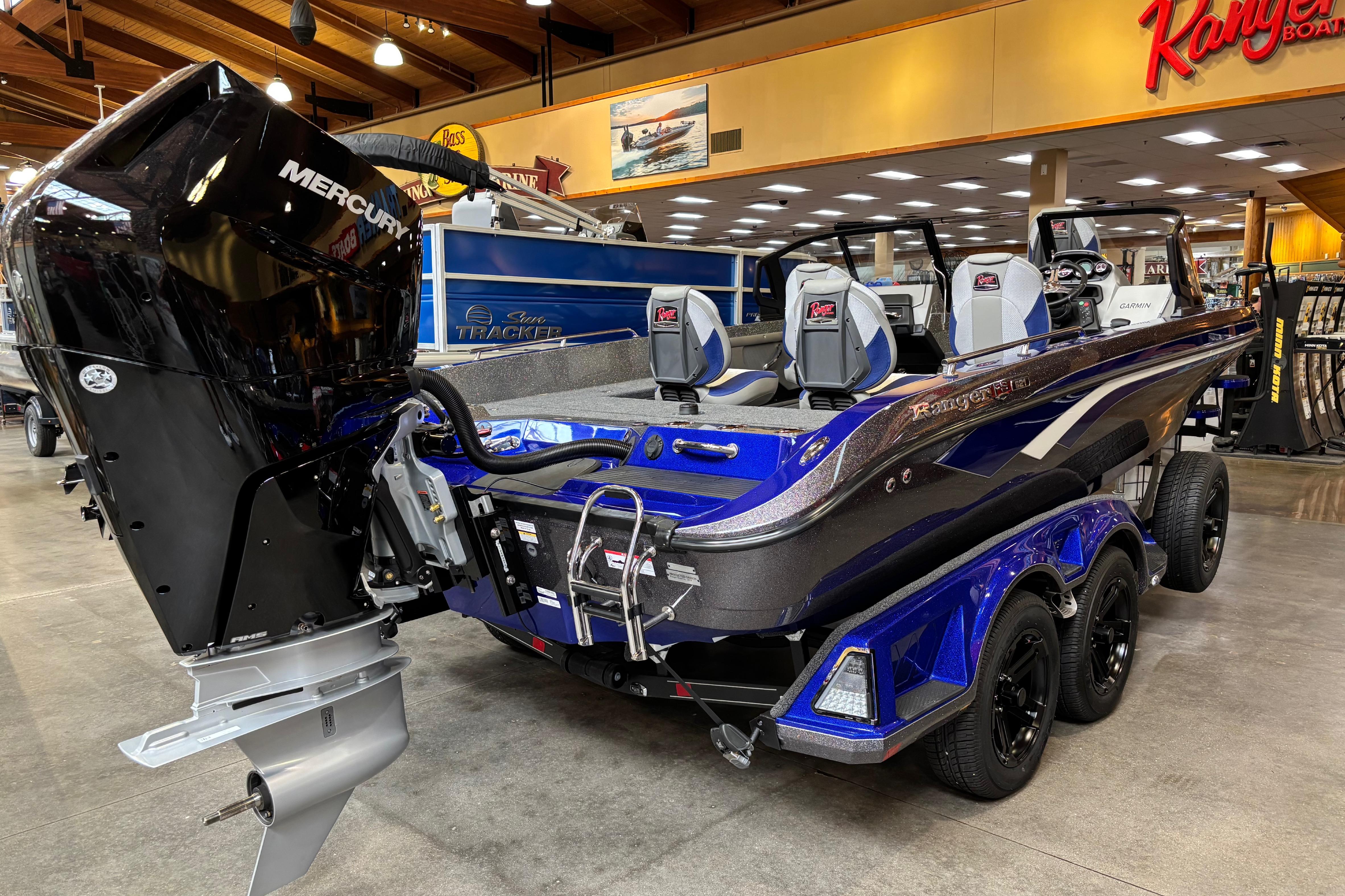 2026 Ranger 621FS Cup-Equipped boat with Mercury engine in showroom.