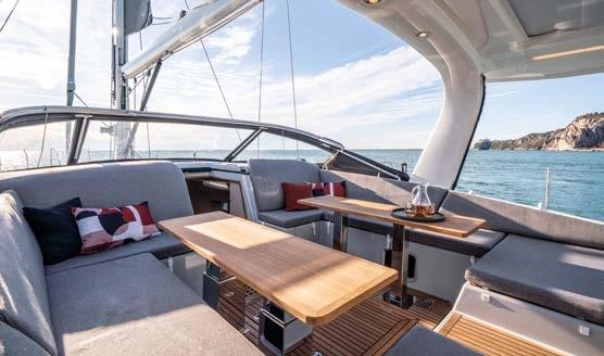 Luxurious 2023 Jeanneau 65 Yacht interior with elegant seating and ocean view.