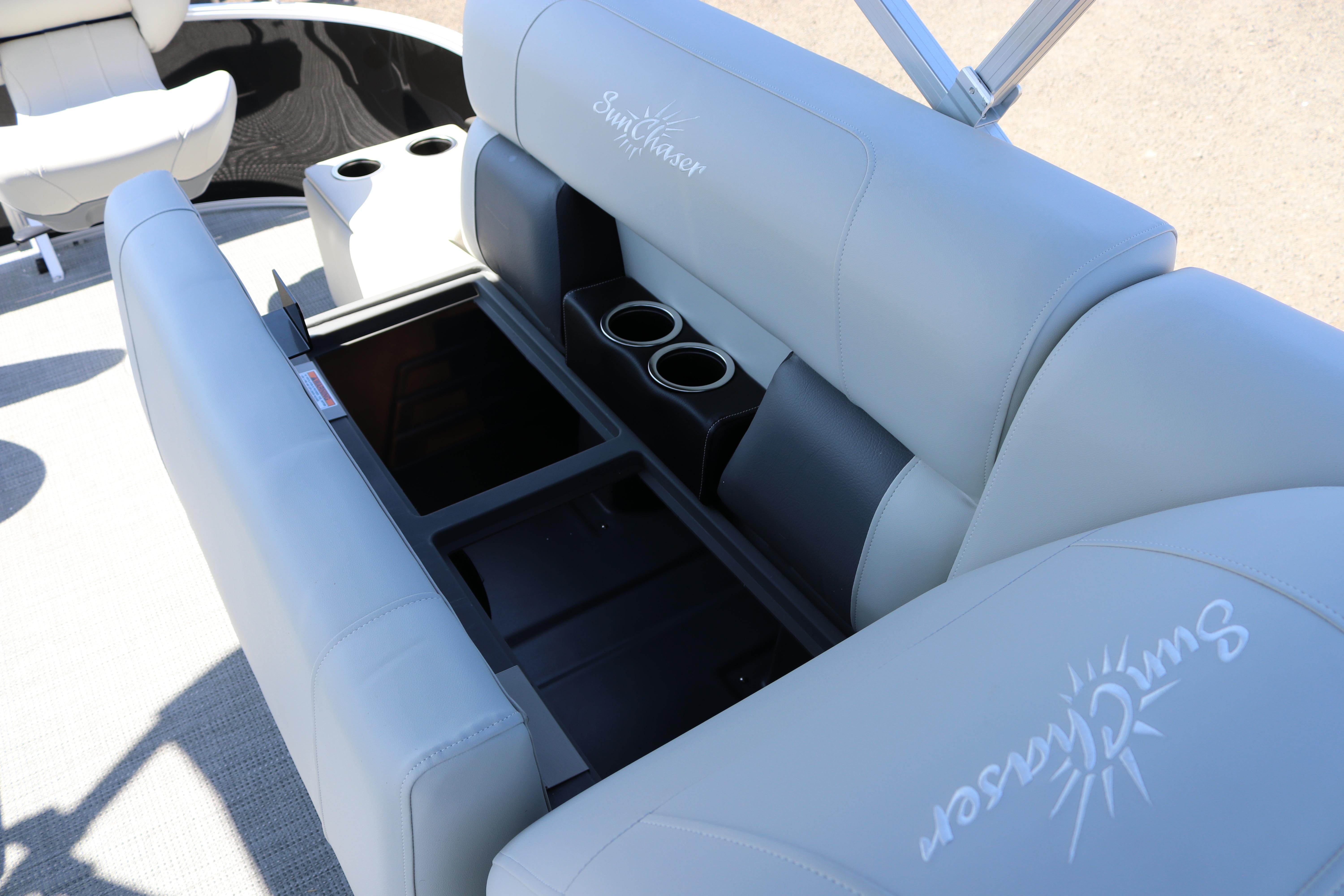 2025 SunChaser Vista 20 Fish boat interior with storage and cup holders.