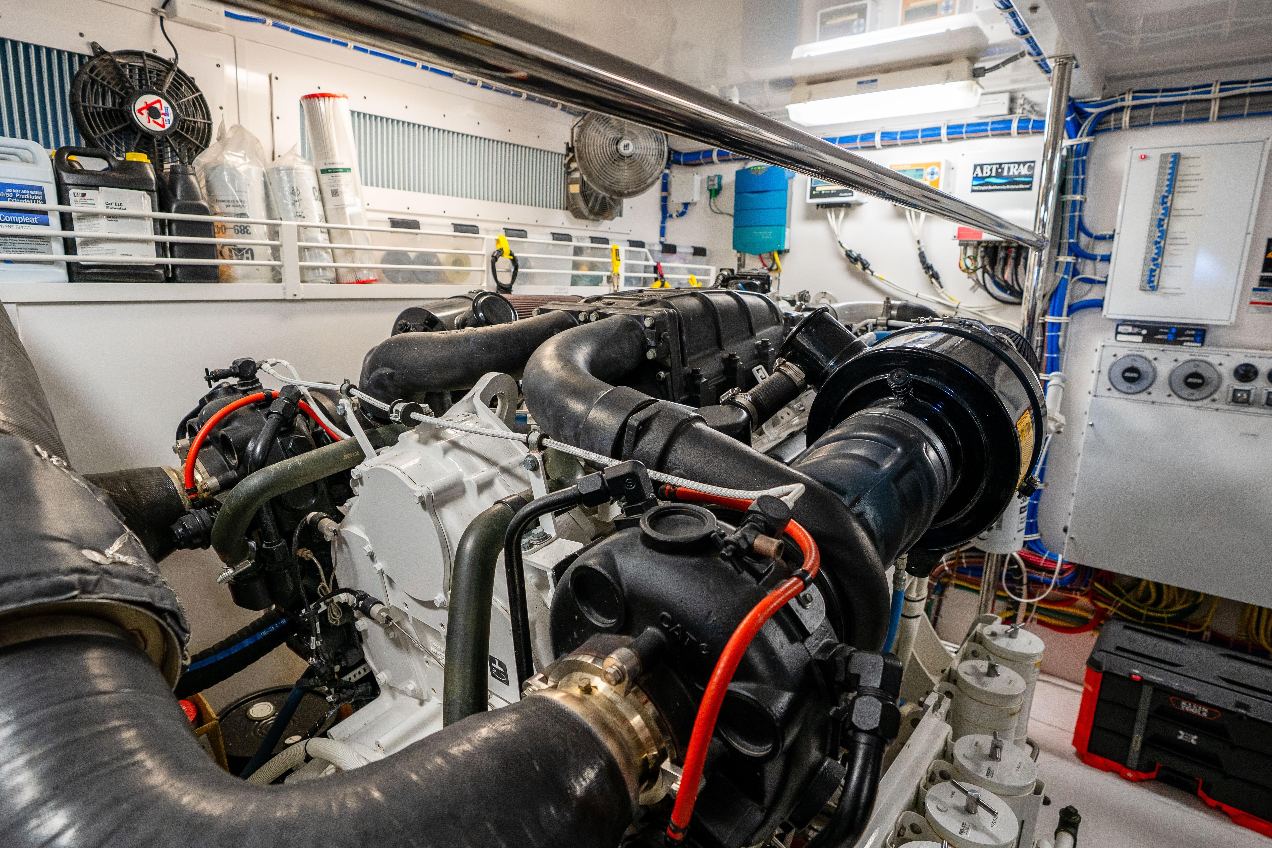 Engine room of 2021 Hatteras M75 Panacera yacht, showcasing advanced machinery and equipment.
