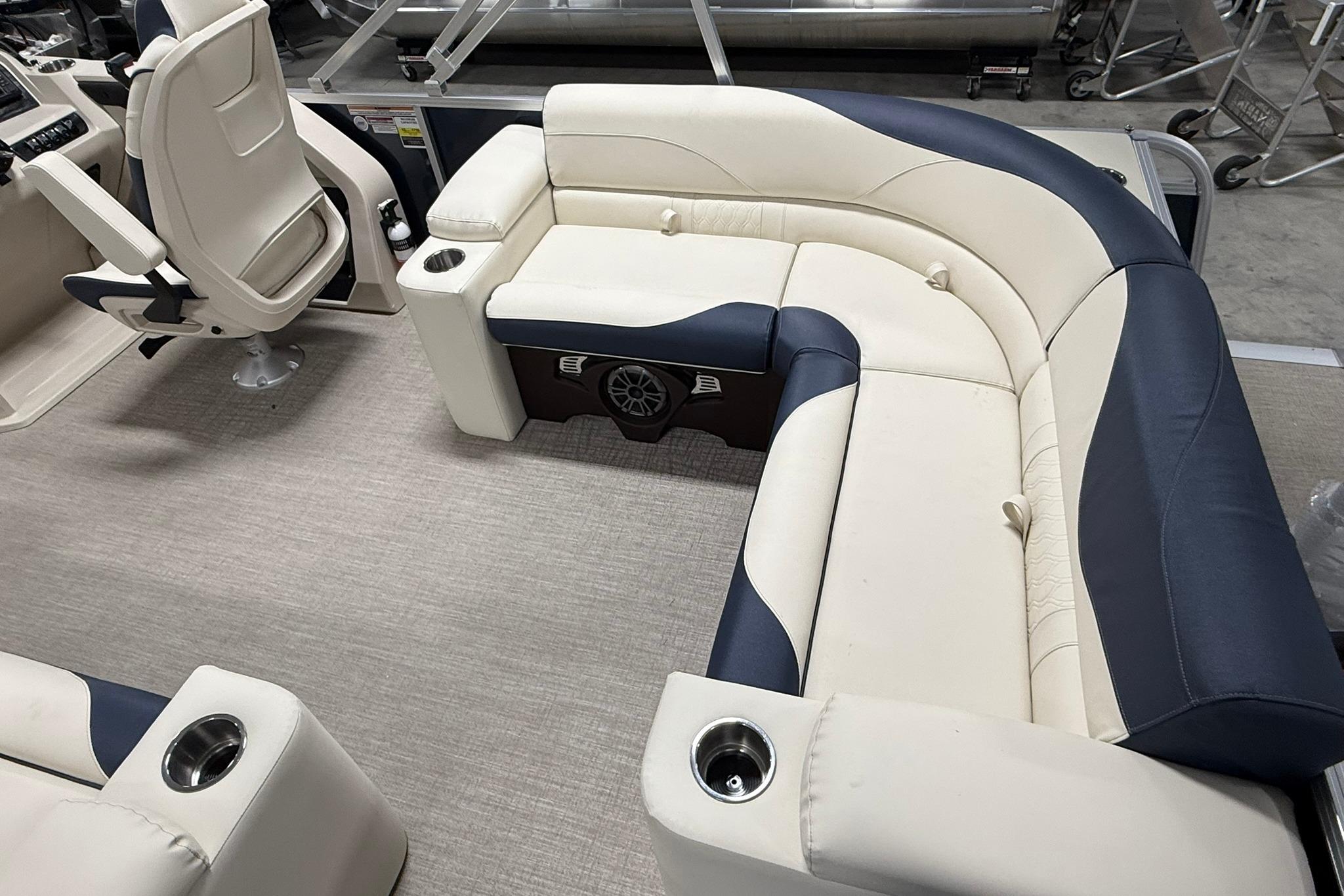 Luxurious seating in 2026 Avalon LSZ Elite 21' pontoon boat, featuring cup holders and premium upholstery.