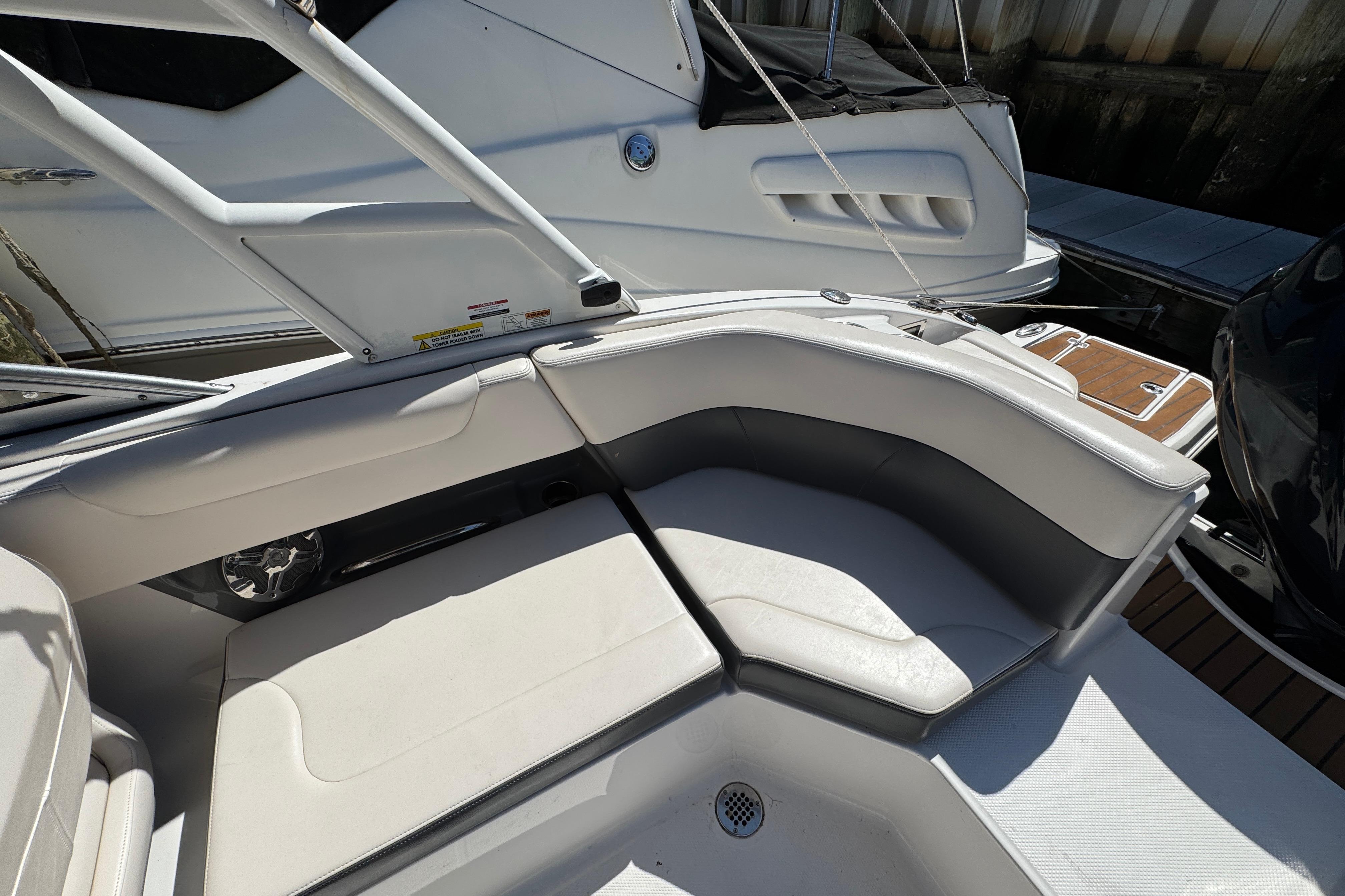 2018 Chaparral 250 Suncoast boat interior with white seating and sleek design.