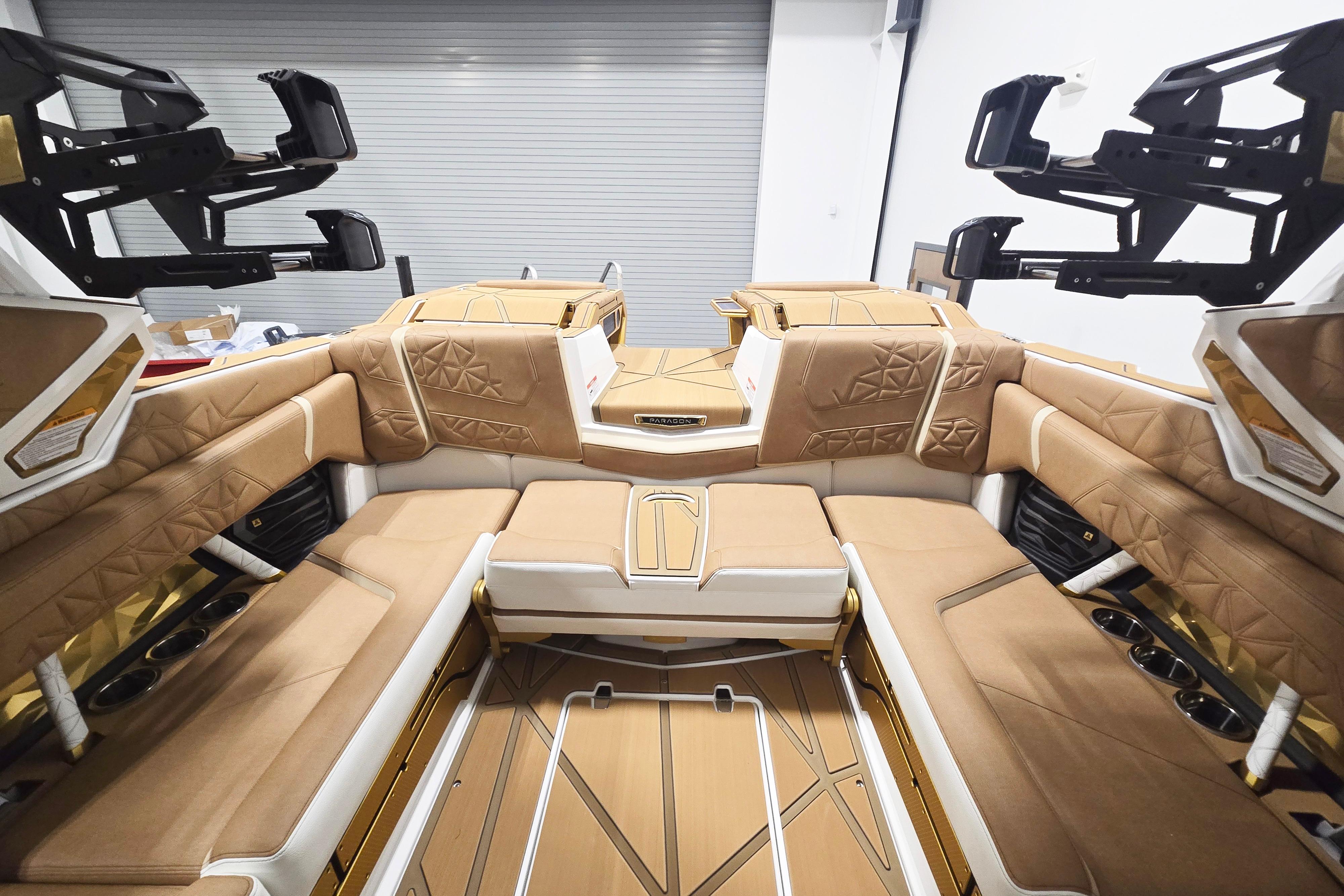 Luxurious interior of 2026 Nautique Super Air Nautique G23 Paragon boat with tan seating.