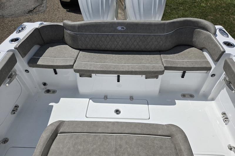 Spacious seating area on 2027 Sea Hunt Ultra 275 SE boat, featuring cushioned benches.