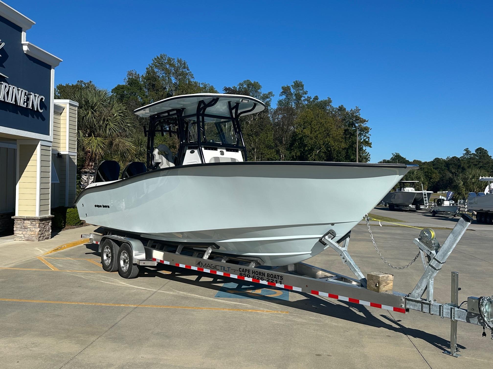 2025 Cape Horn 28XS boat on trailer outside marine dealership.