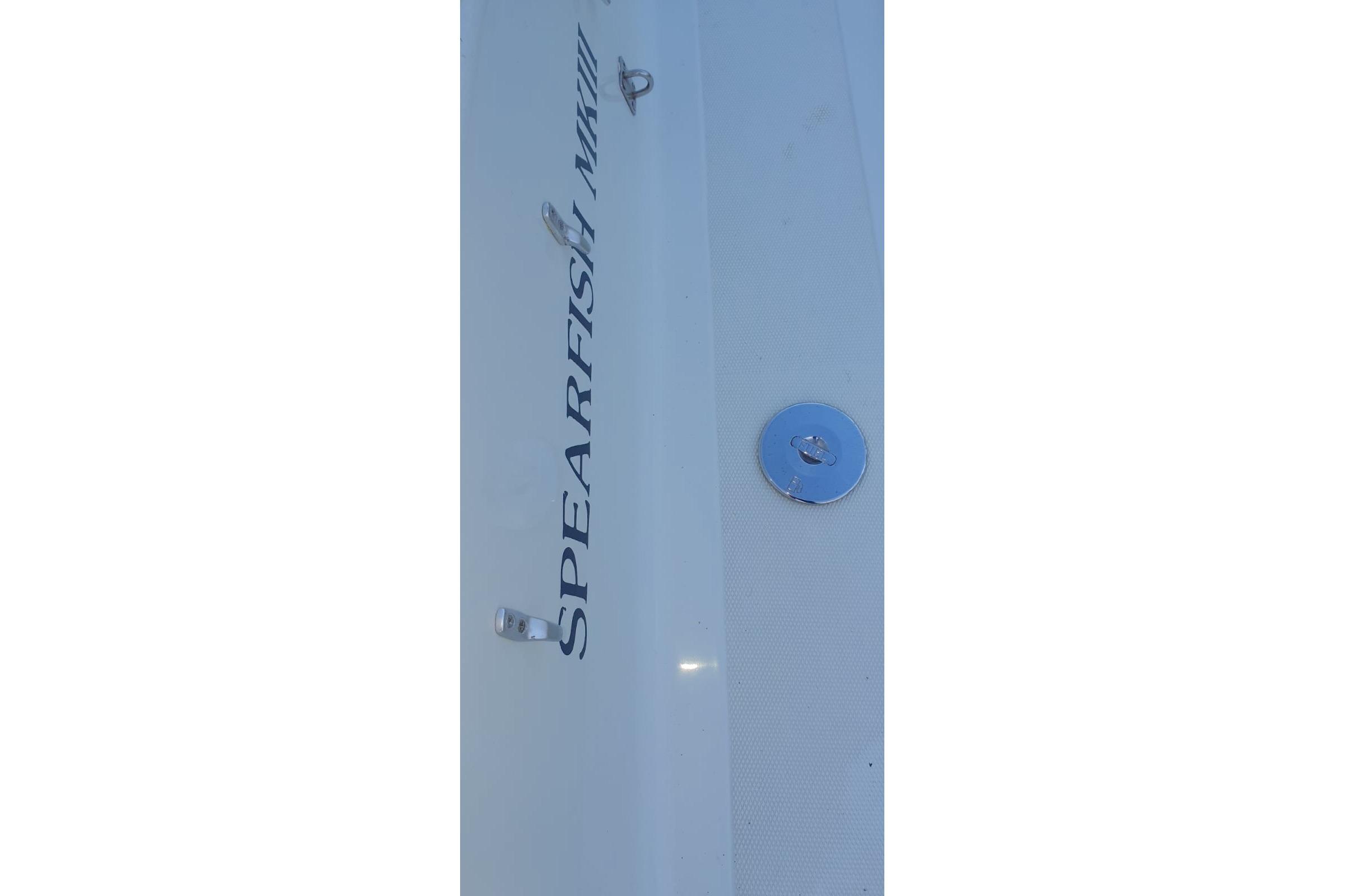1989 Fairey Spearfish MKIII boat hull with logo and metal fittings.