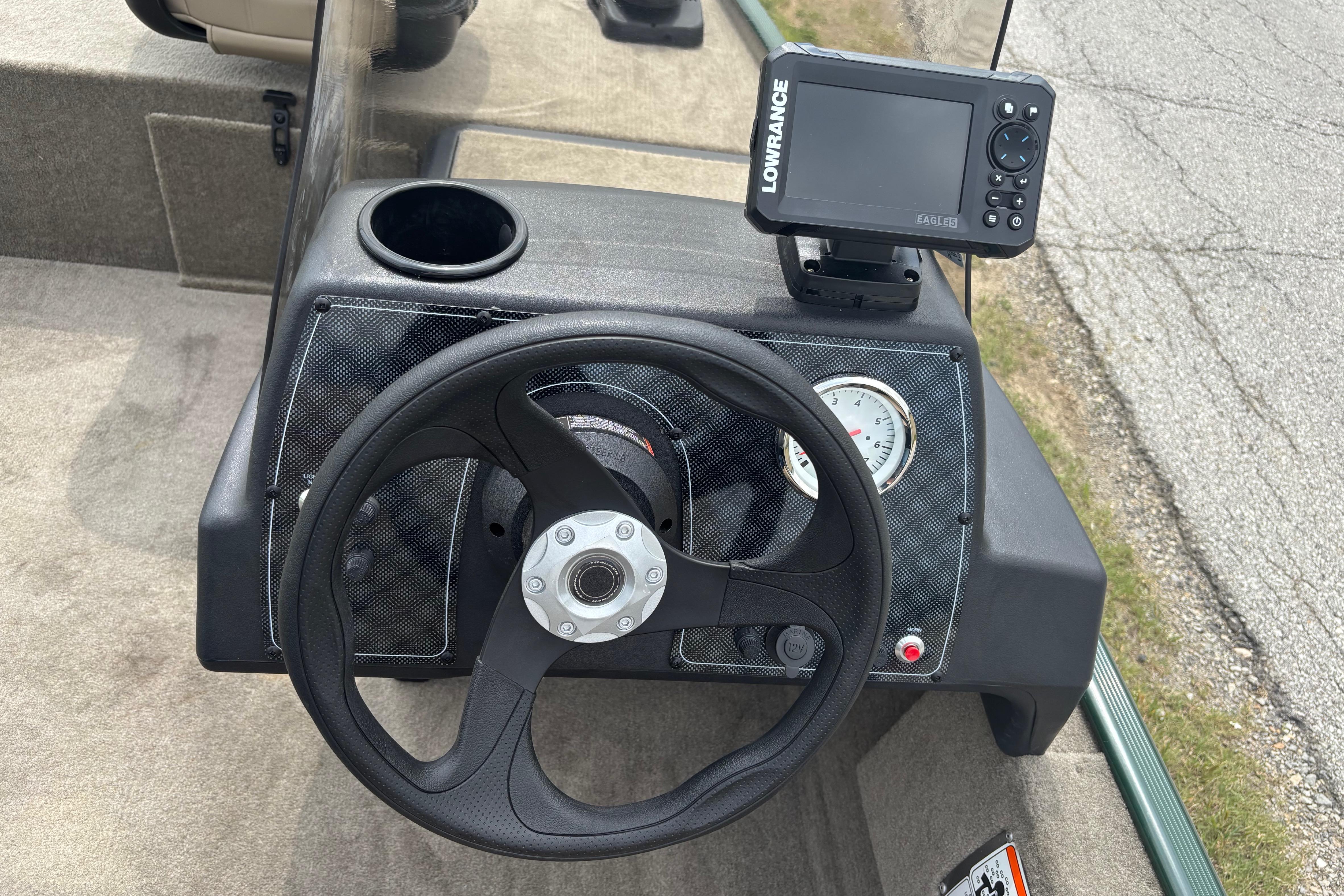 Steering console of 2026 Tracker Bass Tracker Classic Limited with Lowrance fish finder.