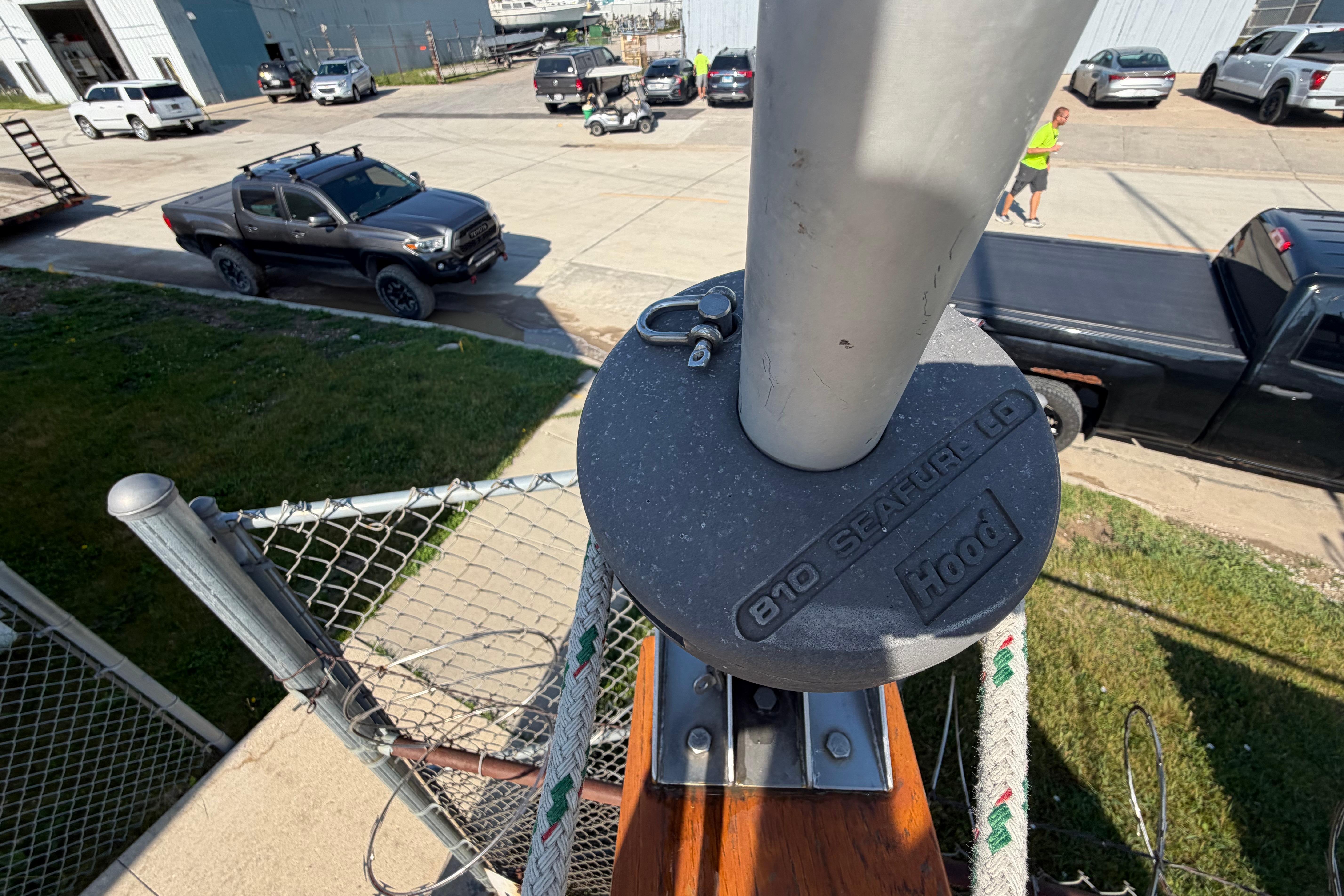 View from Catalina 30 MkII mast, overlooking parked vehicles and industrial area.