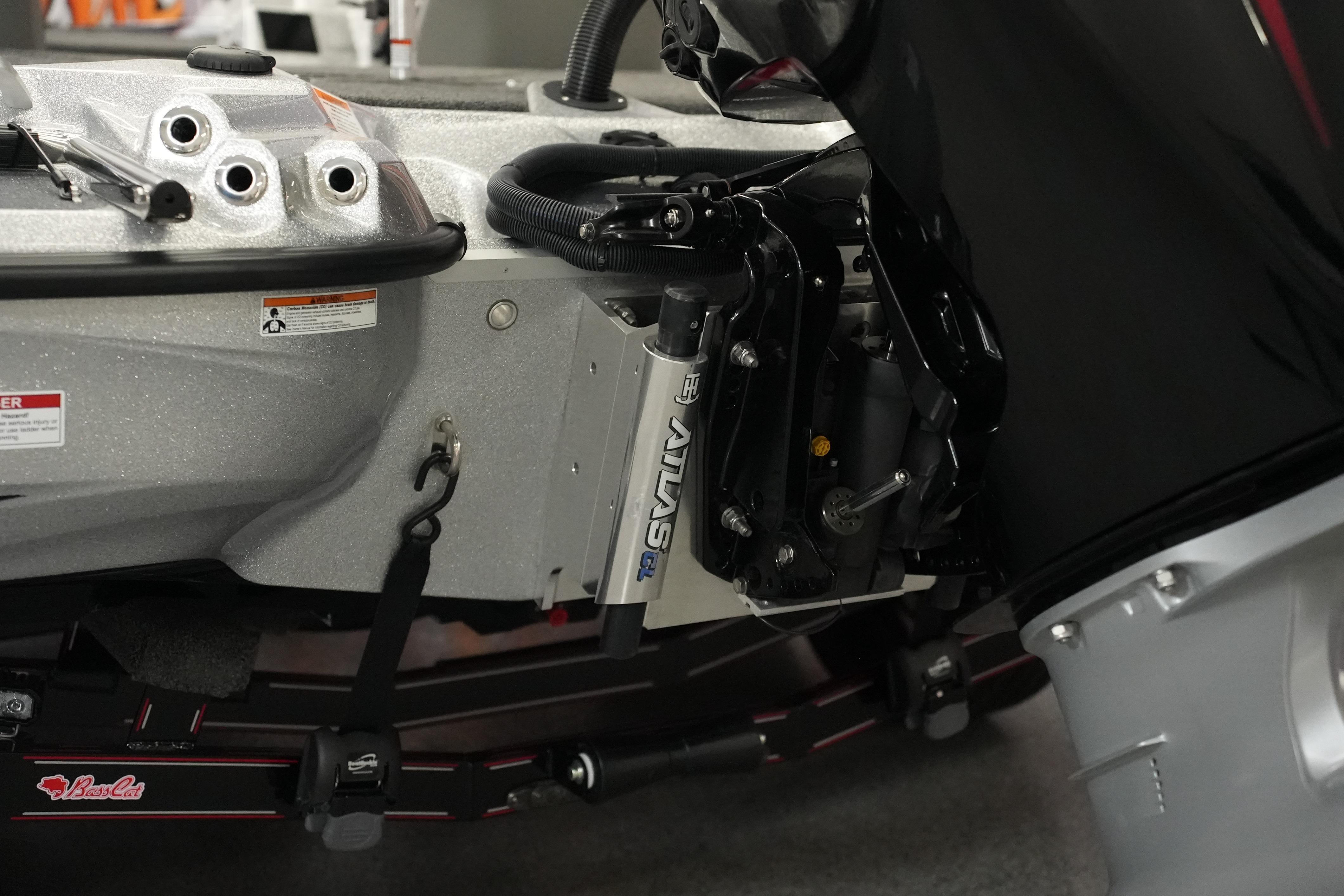 2026 Bass Cat Lynx STS boat engine and hydraulic system close-up.